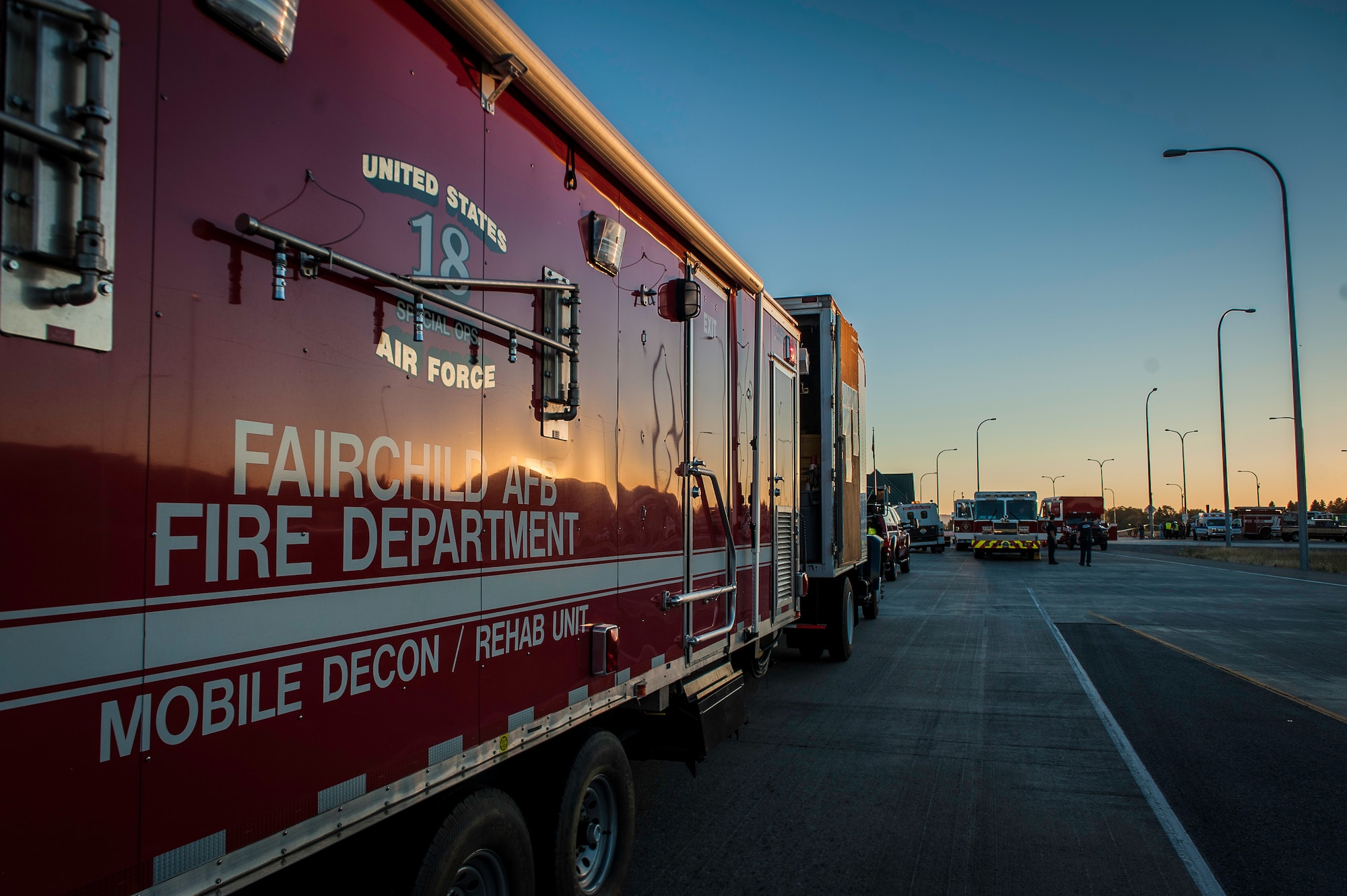 Fairchild Air Force Base firefighters responded with other regional firefighters to a hazardous materials spill incident where they performed decontamination, mitigation and rehabilitation support near the Washington-Idaho state line Sept. 14, 2014. Four Fairchild Air Force Base firefighters, one technician and a variety of support staff as well as the base’s mobile decontamination and rehabilitation unit joined two dozen other firefighters, trucks and equipment from Spokane regional fire districts in response to a tanker truck leaking anhydrous trimethylamine. The incident prompted emergency responders to shut down a 6-mile section of Interstate 90. The toxic leaked substance is a flammable material used in making solvents, animal feed supplements and products consumed by the paper, oil and gas industries. (U.S. Air Force photo by Staff Sgt. Benjamin W. Stratton/Released)