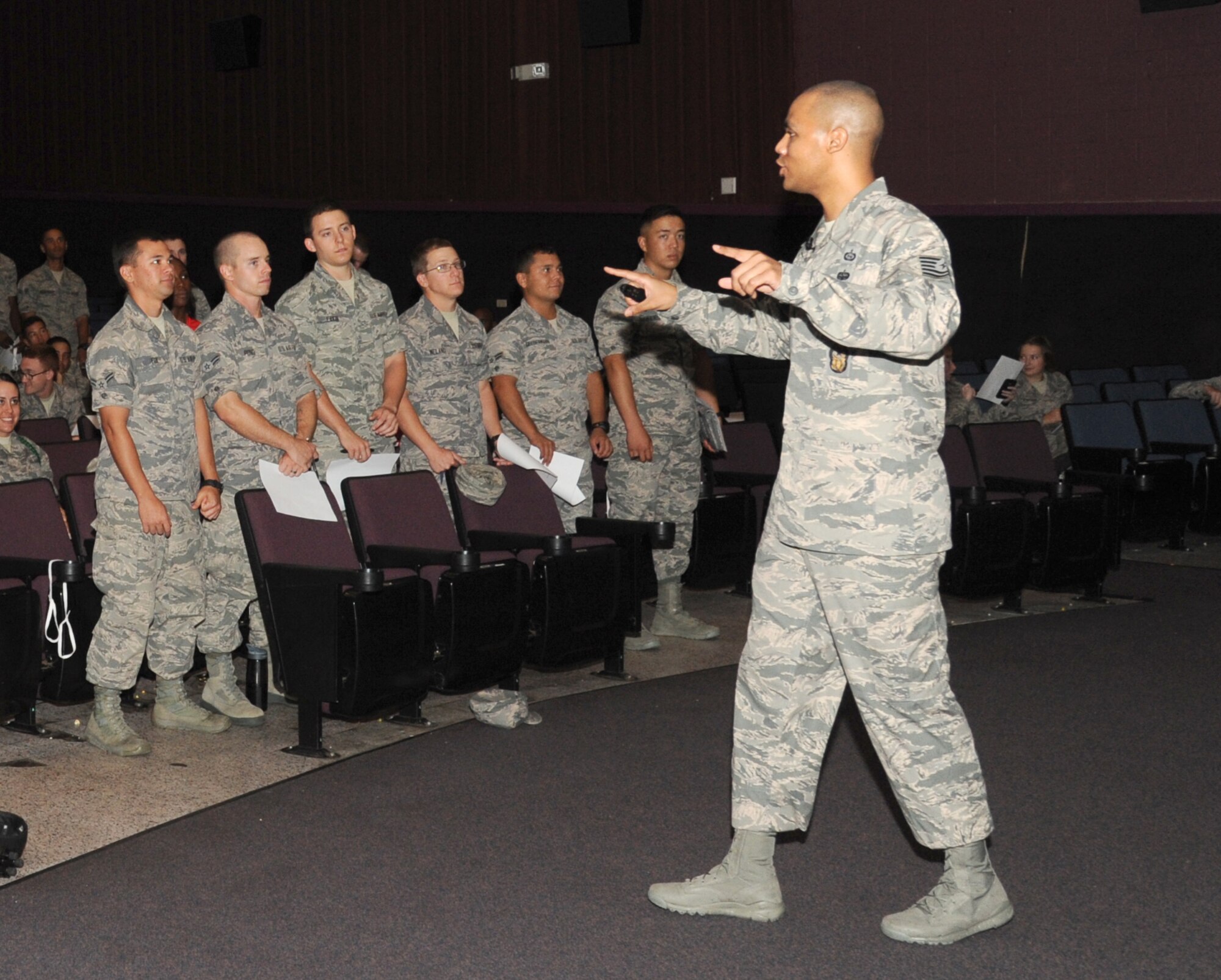 Tech. Sgt. Jewell Hicks, inspector/operations, Lackland Air Force Base, Texas, delivers a presentation to Keesler Airmen during an Airmen Building Airmen program Sept. 12, 2014, at the Welch Theater, Keesler Air Force Base, Miss.  The goal of the symposium was to create a platform where outstanding Airmen can impart their wisdom to the next generation of Airmen.  The event included other guest speakers and a social mixer. (U.S. Air Force photo by Kemberly Groue)