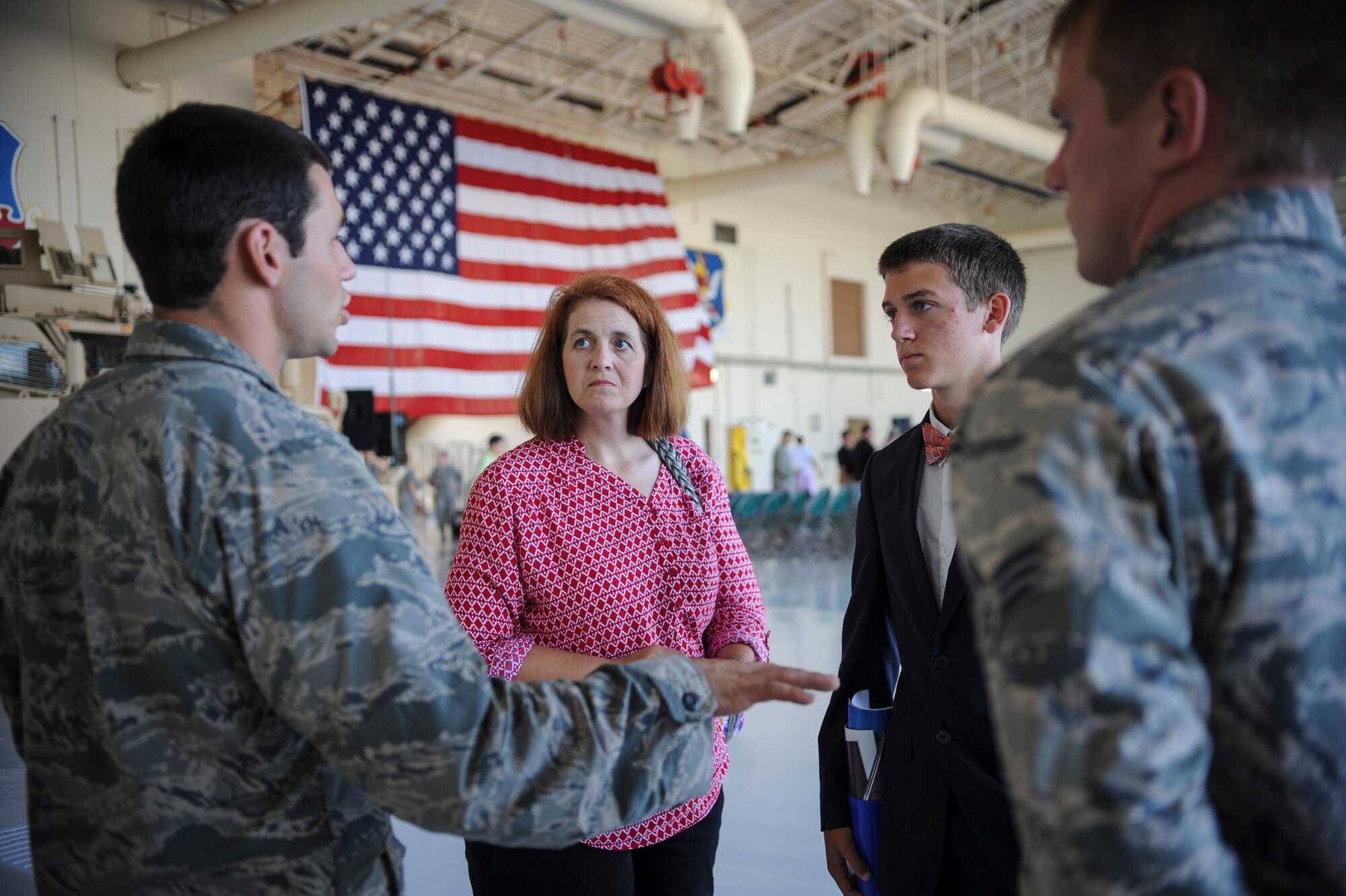 U.S. Air Force 1st Lt. Ryan Witzig, 38th Rescue Squadron combat rescue officer, talks to Aleta Larger and her son, Lehi, about his personal experiences at the U.S. Air Force Academy during the 2014 Military Service Academy Day Sept. 13, at Moody Air Force Base, Ga.. Larger, 14, is a 9th grade student at Tift County High School, who is interested in attending the Air Force Academy. (U.S. Air Force photo by Andrea Jenkins)
