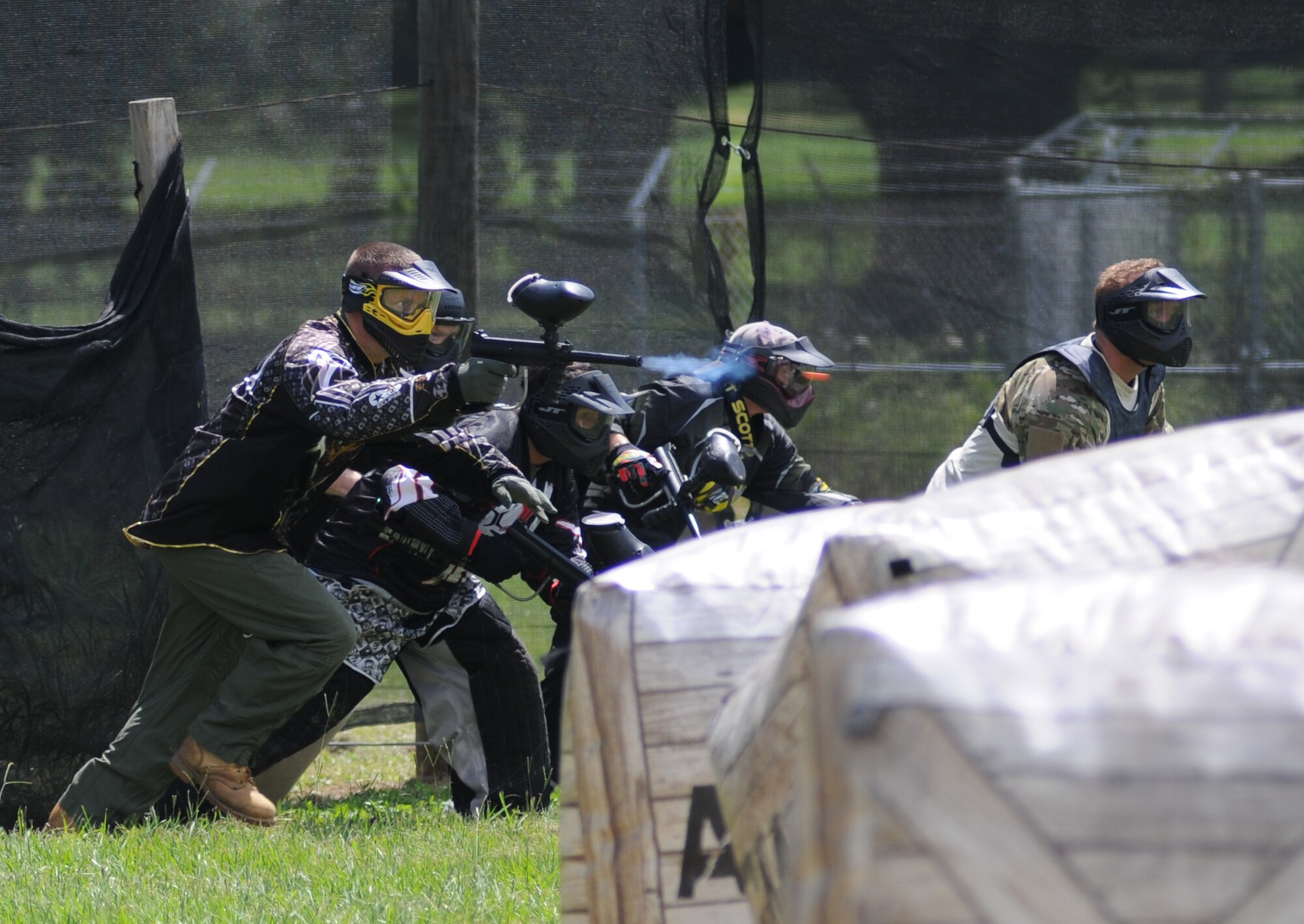Members of the 403rd Wing team up to take part in the Fisher House Fundraiser paintball tournament Sept. 12, 2014, at the paintball complex, Keesler Air Force Base, Miss.  The event also included food, games and a dunking booth. (U.S. Air Force photo by Kemberly Groue)