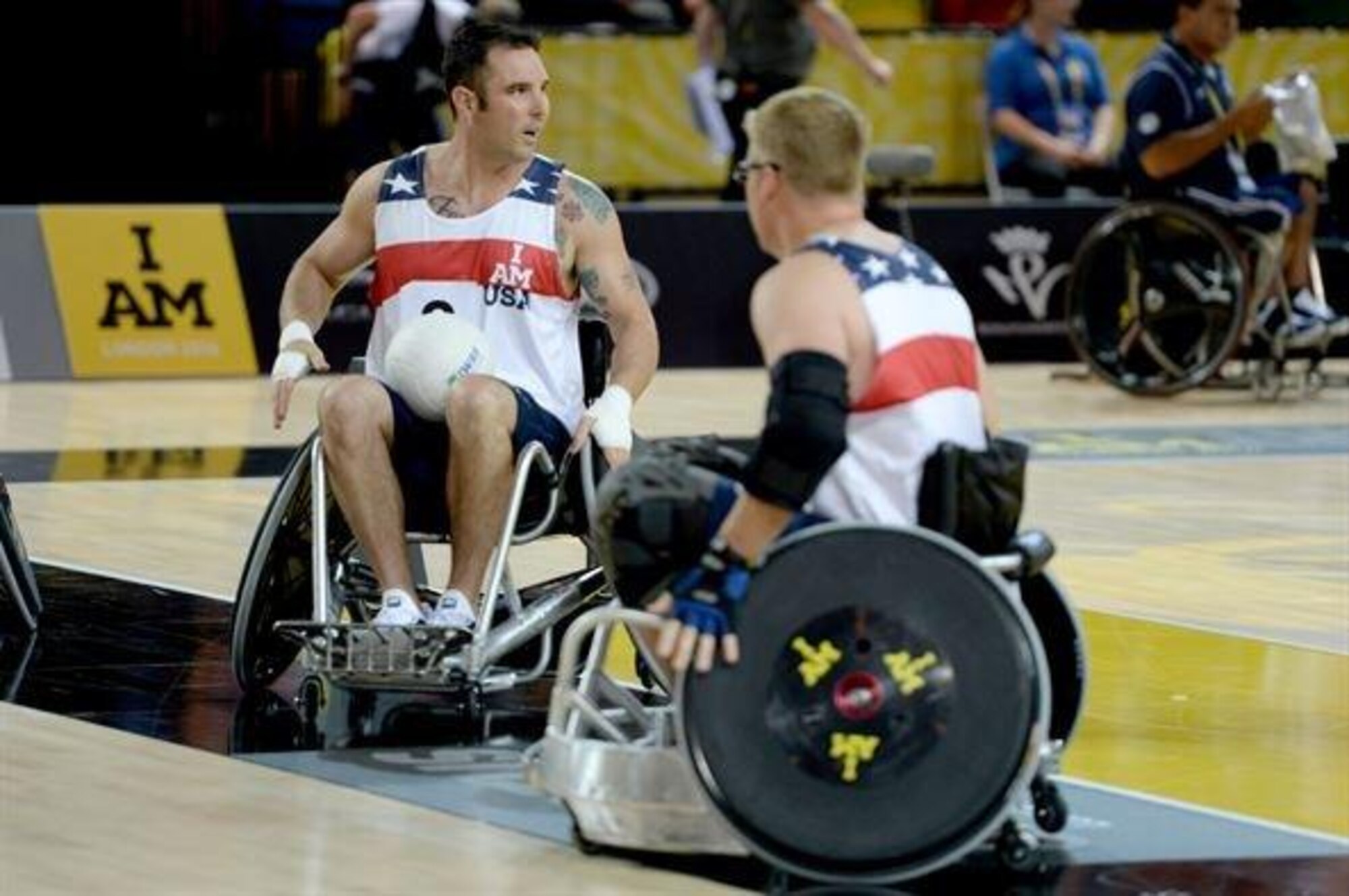 Air Force Staff Sgt. Christopher D'Angelo warms up before a wheelchair rugby match against the Australian wheelchair rugby team Sept. 12, 2014, at the 2014 Invictus Games in London. Invictus Games is an international competition that brings together wounded, injured and ill service members in the spirit of friendly athletic competition. American Soldiers, Sailors, Airmen and Marines are representing the U.S. in the competition which is taking place from Sept. 10-14. (U.S. Navy photo/Mass Communication Specialist 2nd Class Joshua D. Sheppard)
