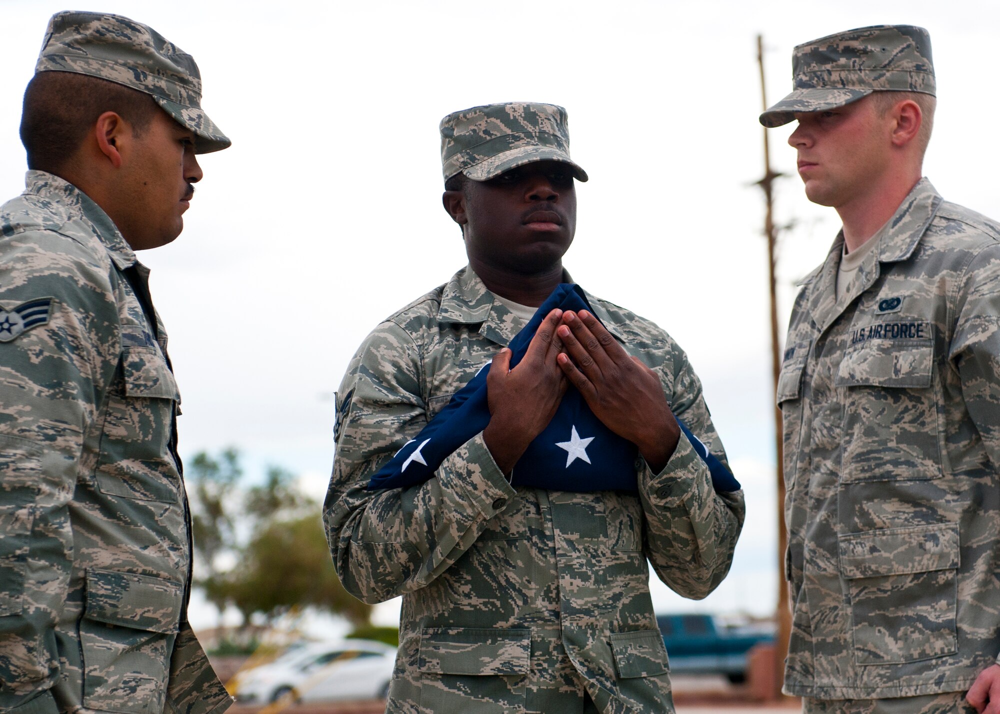 Members of the 49th Wing Steel Talons Honor Guard fold the flag during a ceremony to commemorate 9/11 at Holloman Air Force Base, N.M., Sept. 11. Team Holloman honored first responders and medical personnel that lost their lives during 9/11 by reciting prayers and creeds.  Holloman AFB pays tribute to those fallen on 9/11 annually with a ceremony at Heritage Park. (U.S. Air Force photo by Senior Airman Daniel E. F. Liddicoet/Released)