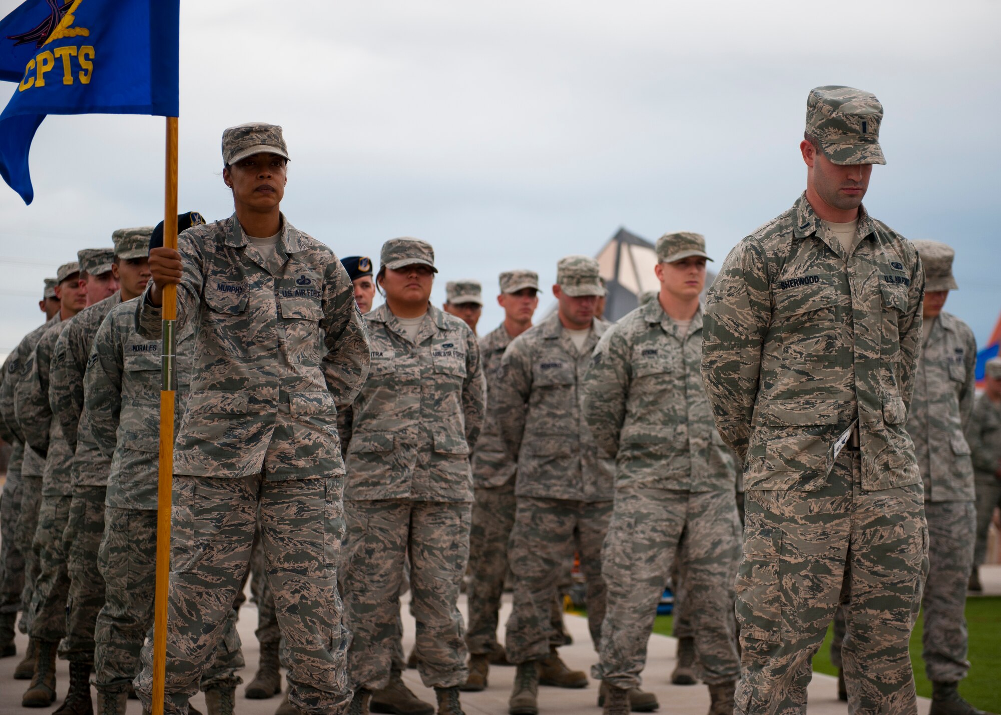 Members of the 49th Wing stand in formation during a ceremony to commemorate 9/11 at Holloman Air Force Base, N.M., Sept. 11. Team Holloman honored first responders and medical personnel that lost their lives during 9/11 by reciting prayers and creeds.  Holloman AFB pays tribute to those fallen on 9/11 annually with a ceremony at Heritage Park. (U.S. Air Force photo by Senior Airman Daniel E. F. Liddicoet/Released)