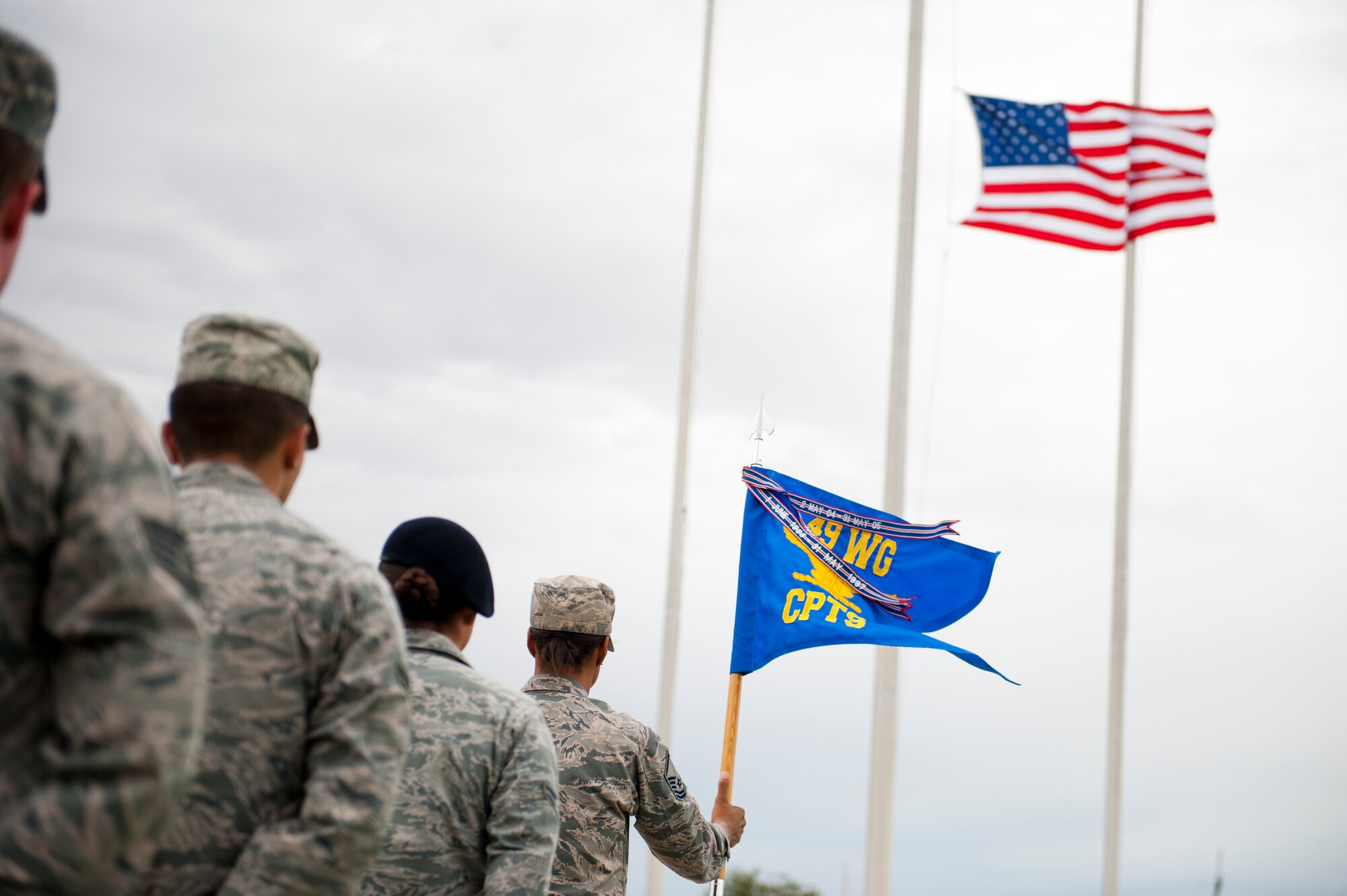 Members of the 49th Wing stand in formation during a ceremony to commemorate 9/11 at Holloman Air Force Base, N.M., Sept. 11. Team Holloman honored first responders and medical personnel that lost their lives during 9/11 by reciting prayers and creeds.  Holloman AFB pays tribute to those fallen on 9/11 annually with a ceremony at Heritage Park. (U.S. Air Force photo by Senior Airman Daniel E. F. Liddicoet/Released)