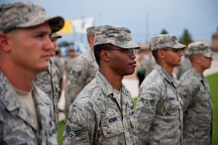 Members of the 49th Wing stand in formation during a ceremony to commemorate 9/11 at Holloman Air Force Base, N.M., Sept. 11. Team Holloman honored first responders and medical personnel that lost their lives during 9/11 by reciting prayers and creeds.  Holloman AFB pays tribute to those fallen on 9/11 annually with a ceremony at Heritage Park. (U.S. Air Force photo by Senior Airman Daniel E. F. Liddicoet/Released)