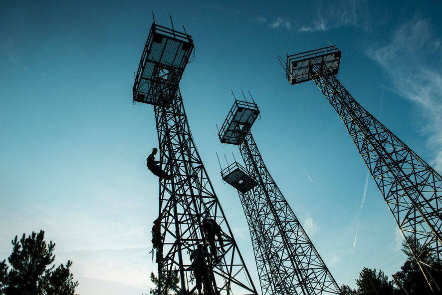 Airmen climb antenna towers during a capabilities demonstration Sept. 12, 2014, at Moody Air Force Base, Ga. The towers support ground-to-air radio antennas used for in-flight communication between air traffic controllers and pilots. (U.S. Air Force photo by Airman 1st Class Ryan Callaghan/Released)