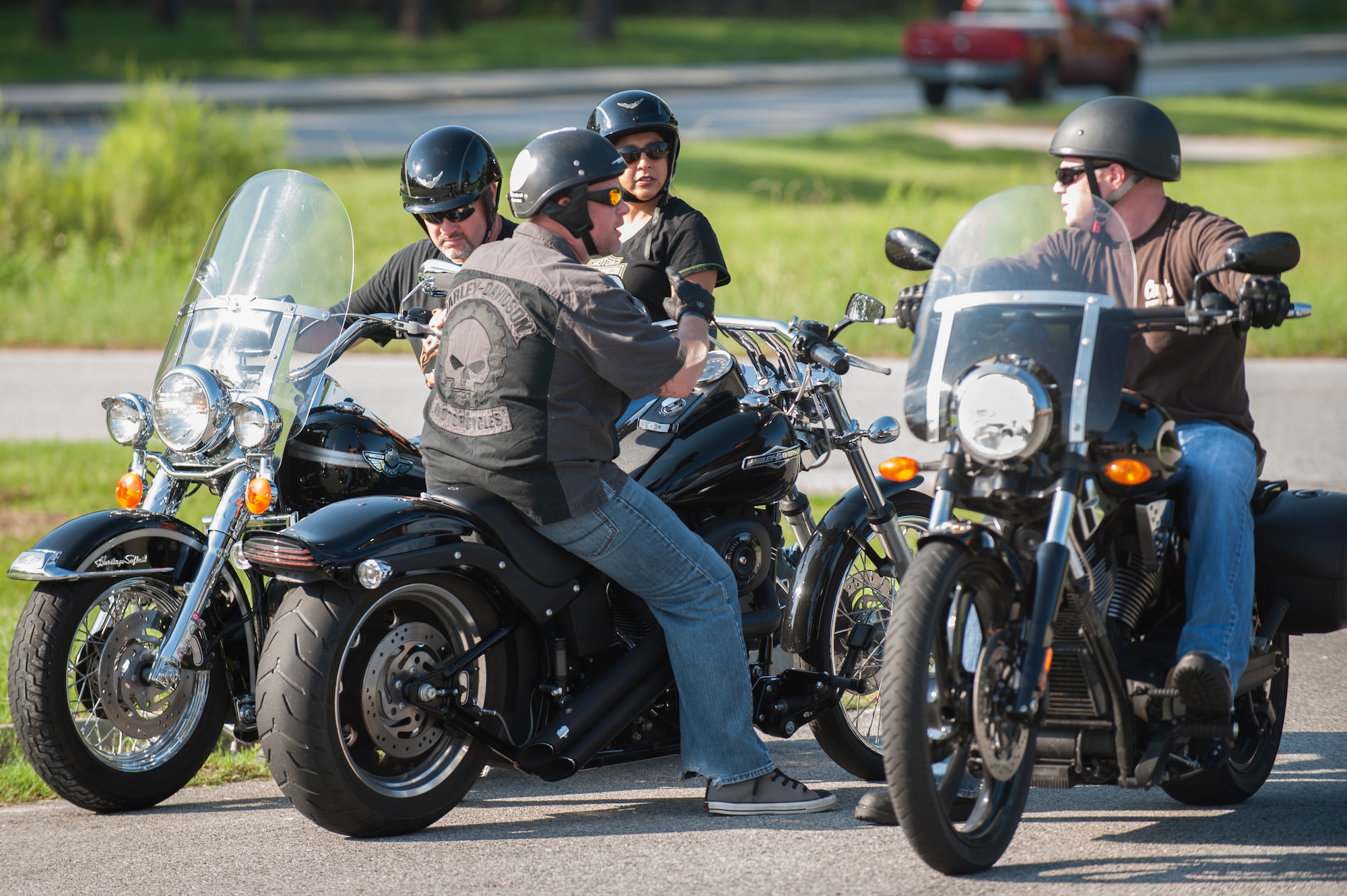 Bikers communicate before kicking off the annual POW/MIA Poker Run Sept. 13, 2014, at Valdosta, Ga. The bikers rode more than 150 miles by traveling round-trip to Tifton, Ga., and back to Valdosta. (U.S. Air Force photo by Airman 1st Class Dillian Bamman/Released)