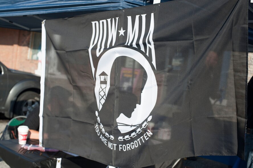 A POW/MIA flag sways in the air during the annual POW/MIA Poker Run Sept. 13, 2014, at Valdosta, Ga. All proceeds from the ride went to building a smart house for a wounded warrior. (U.S. Air Force photo by Airman 1st Class Dillian Bamman/Released)
