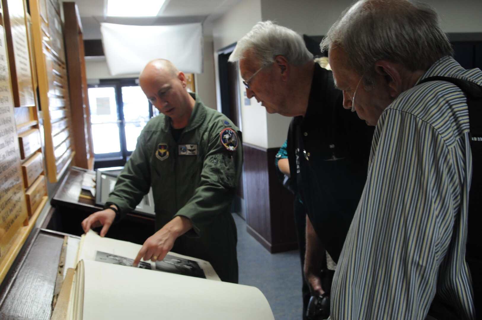 Retired U.S. Air Force Lt. Col. George McKinney (right) and retired Lt. Col. Dee Simonds (center) share their history and knowledge with Lt. Col. Mark Schmidt, 435th Fighter Training Squadron commander, Sept. 5, 2014, during an Introduction to Fighter Fundamentals Course graduations at Joint Base San Antonio-Randolph.  Simmonds and McKinney were members of the 435th Tactical Fighter Squadron, now the 435th FTS at JBSA-Randolph, when they became the first F-4 Phantom crew to shoot down two MiG-21 aircraft during a single mission Nov. 6, 1967.  (U.S. Air Force photo by 2nd Lt. Chris Flowers)