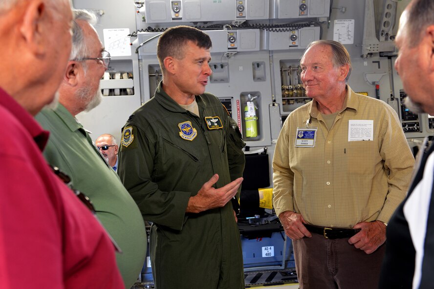 Col. Andy Hird (middle), 62nd Operations Group commander, talks to members from the 62nd Troop Carrier reunion about the C-17 Globemaster III Sept. 12, 2014, during their tour at Joint Base Lewis-McChord, Wash. The tour included a briefing about the type of missions flown by the 62nd Airlift Wing today and how the squadrons deploy as units. (U.S. Air Force photo/Airman 1st Class Keoni Chavarria)