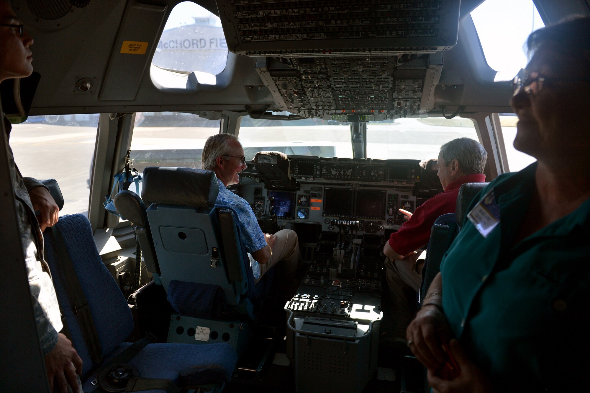 Members from the 62nd Troop Carrier reunion tour explore the flight deck of a C-17 Globemaster III Sept. 12, 2014, during their base visit to Joint Base Lewis-McChord, Wash. During the tour, the group had a meet and greet with Col. Ethan Griffin, 62nd Airlift Wing vice commander, and a tour of the air park prior to going on the C-17 Globemaster III. (U.S. Air Force photo/Airman 1st Class Keoni Chavarria)