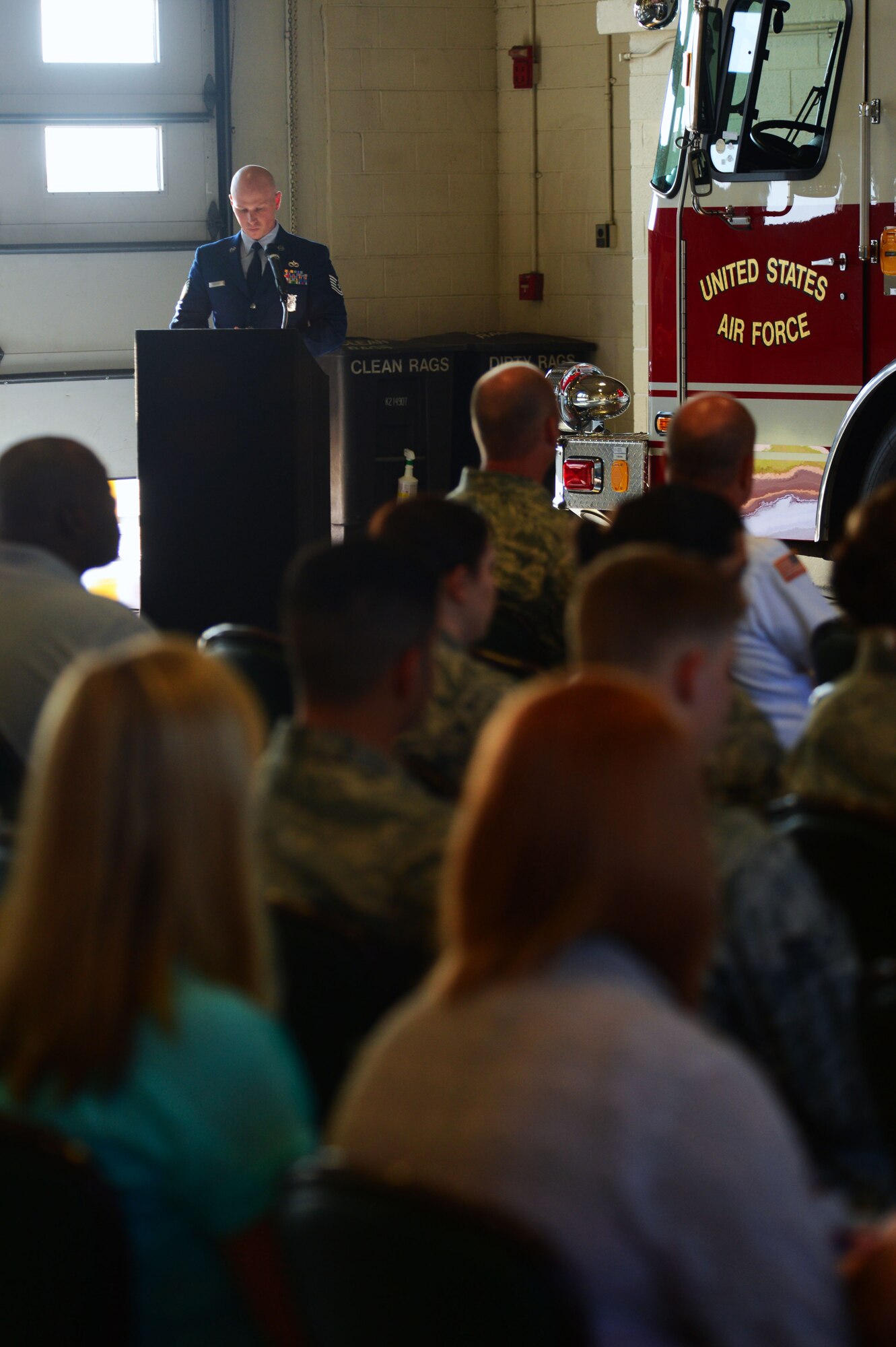 U.S. Air Force Tech. Sgt. Adam Gardner, 20th Civil Engineer Squadron firefighter, speaks during a 9/11 memorial ceremony at Shaw Air Force Base, S.C., Sept. 11, 2014. Approximately 40 people attended the ceremony to honor the firefighters who lost their lives during the events on 9/11. (U.S. Air Force photo by Airman 1st Class Jensen Stidham/Released)