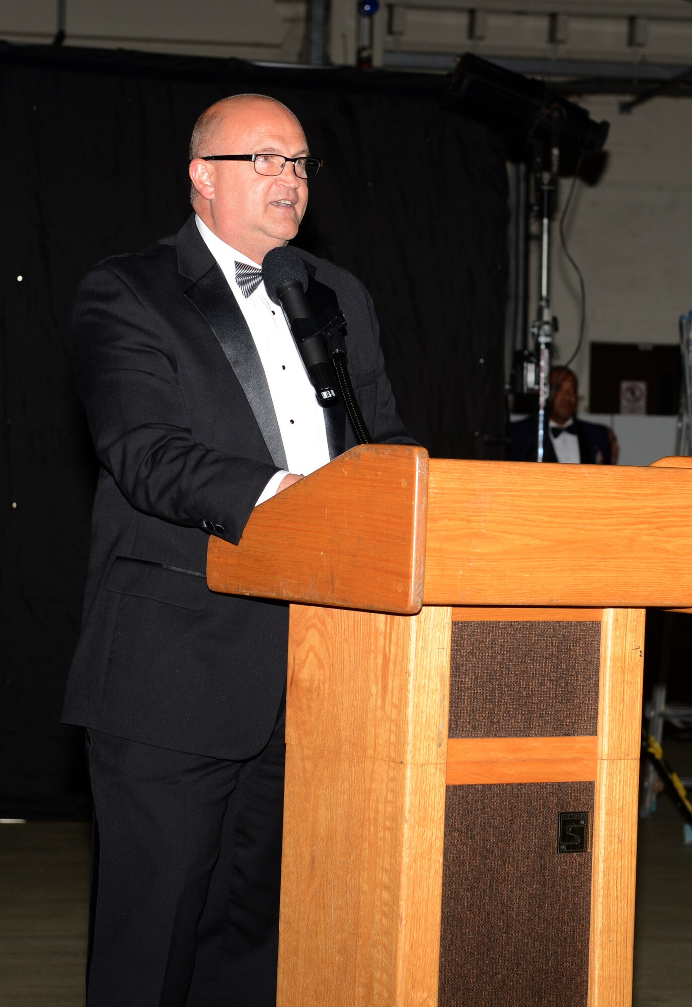 Bruce Barton, 48th Force Support Squadron, force development flight chief, speaks to the crowd during the Air Force Ball on Royal Air Force Lakenheath, England,  Sept. 13, 2014. More than 350 people attended the event, which celebrated the Air Force’s 67th birthday and highlighted the history of RAF Lakenheath.  (U.S. Air Force photo by Airman 1st Class Trevor T. McBride/Released)