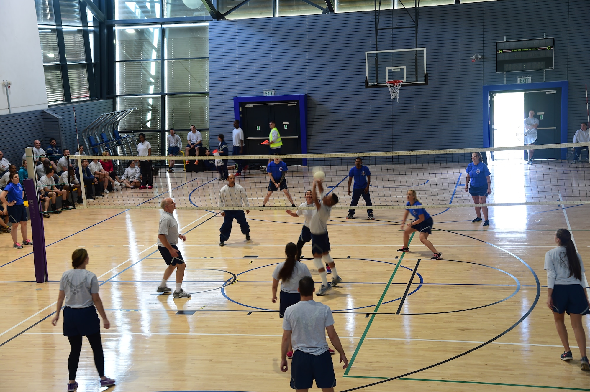 An Airman sets a volleyball during an intramural Commander’s Challenge match Sept. 11, 2014, at Ramstein Air Base, Germany. The Commander’s Challenge was a friendly competition that put Airmen against Airmen to see who would leave with the first place trophy. (U.S. Air Force photo/Staff Sgt. Travis Edwards)