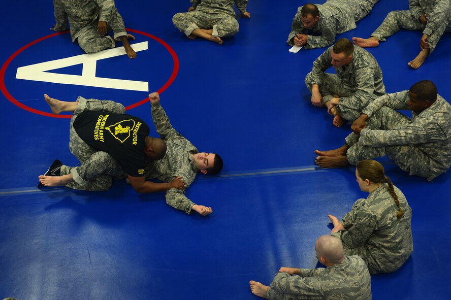 U.S. Army Sgt. 1st Class Don Edwards, U.S. Army Central G4 Operations NCO in charge, demonstrates fighting techniques at during a Modern Army Combatives Program course at Shaw Air Force Base, S.C., Sept. 9, 2014. Six soldiers and five U.S. Air Force Airmen participated in the 5-day course, which occurs once a month. (U.S. Air Force photo by Airman 1st Class Jensen Stidham/Released)
