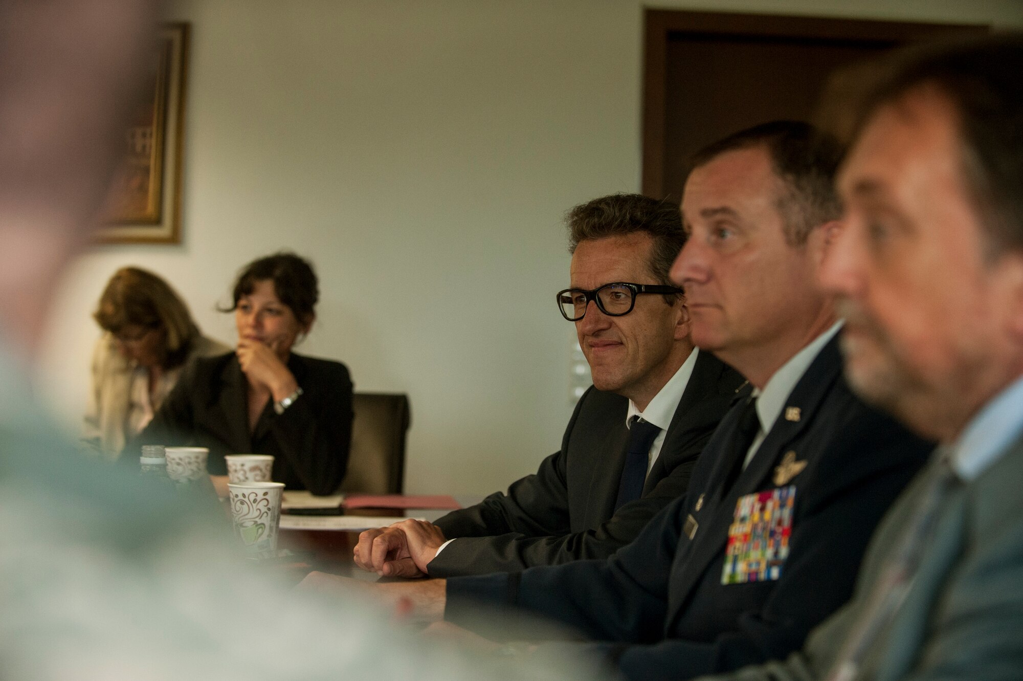 Dr. Joachim Streit, county commissioner of Eifelkreis Bitburg, listens to a German translation during the community information forum Sept. 11, 2014, at Spangdahlem Air Base, Germany. The forum provided a way for local community leaders to discuss upcoming base projects with 52nd Fighter Wing leadership. (U.S. Air Force photo by Senior Airman Rusty Frank/Released)