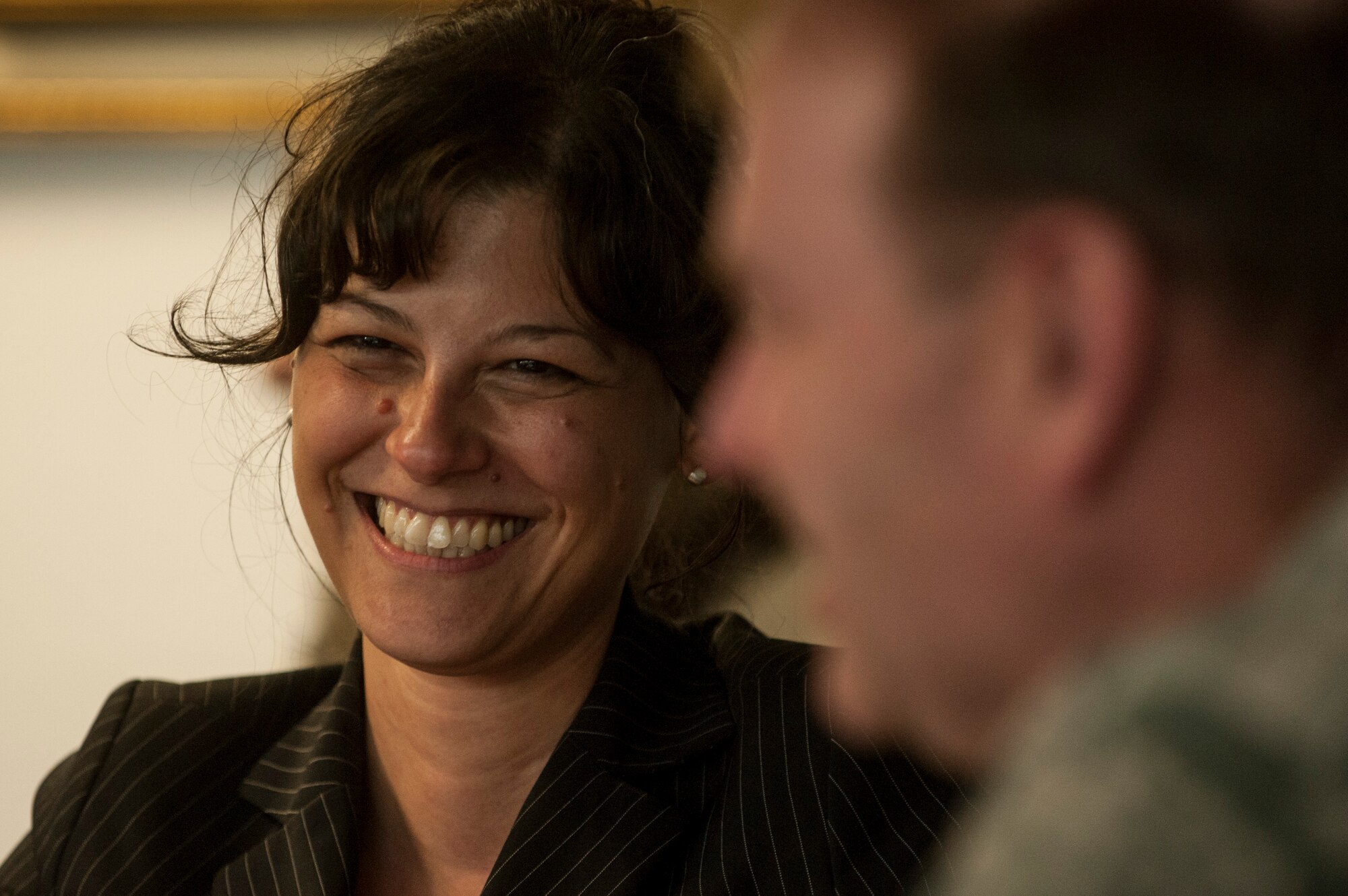 Elena Mazzola, interior minister for Rheinland-Pfalz, smiles prior to the start of a community information forum Sept. 11, 2014, at Spangdahlem Air Base, Germany. Mazzola is responsible for German and allied military forces for the state of Rheinland-Pfalz. (U.S. Air Force photo by Senior Airman Rusty Frank/Released)