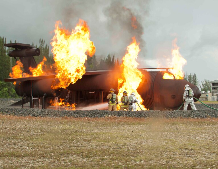 Aric Almirola, driver of the No. 43 Richard Petty Motorsports Ford racecar, participates in a live fire exercise with members of the 482nd Mission Support Group Fire Department at Homestead Air Reserve Base, Fla., Sept. 10. Almirola visited Homestead ARB before heading to Chicagoland Speedway to participate in the “Chase for the NASCAR Sprint Cup”. (U.S. Air Force photo/Senior Airman Aja Heiden)