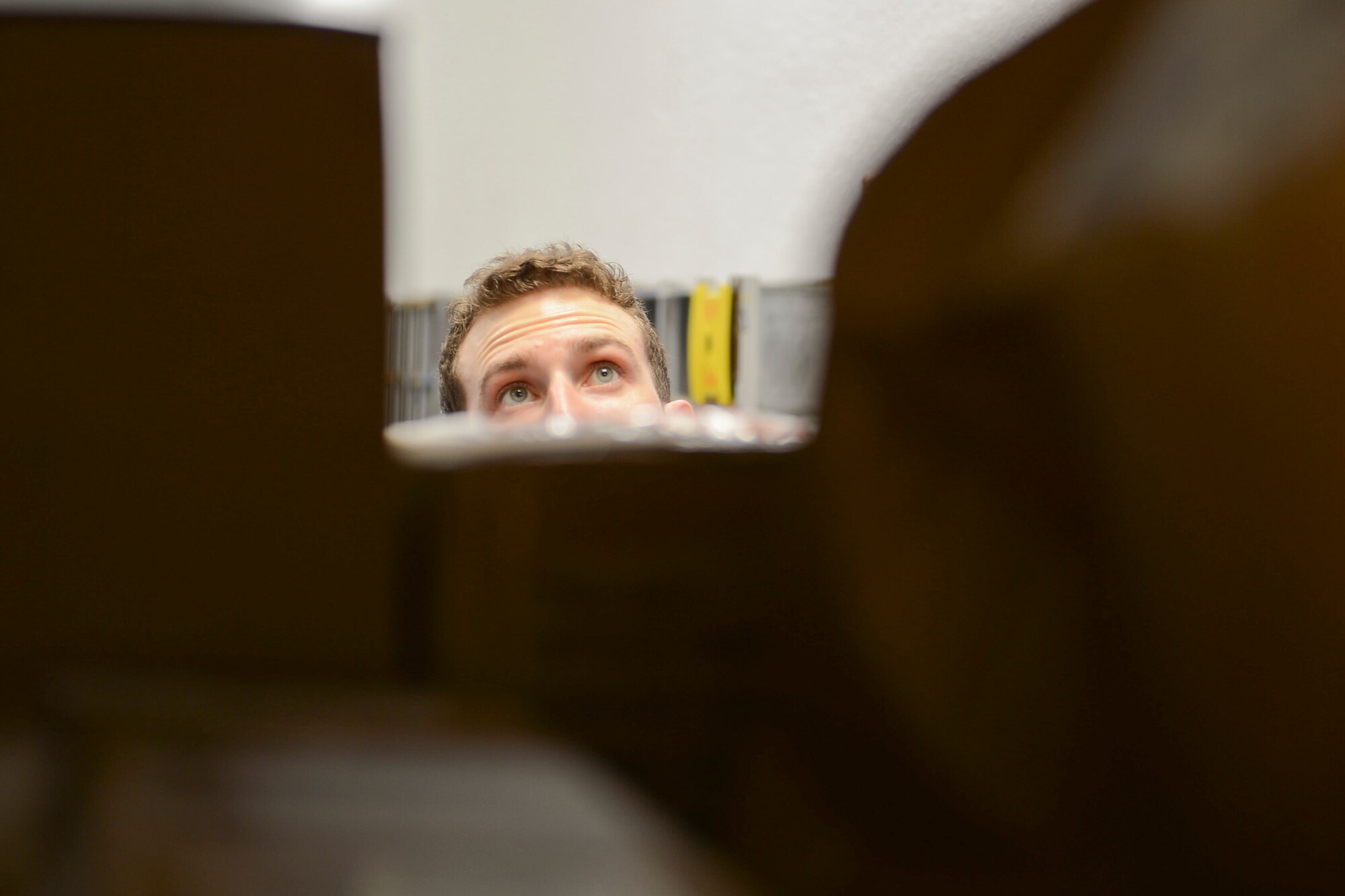 Senior Airman Kyle Dinkel, 86th Communications Squadron postal specialist, scans packages at the Northside post office on Ramstein Air Base, Sept. 9, 2014. In an average month, Ramstein processes about 55,000 personal packages and about 5,000 official packages. (U.S. Air Force photo/Airman 1st Class Michael Stuart)