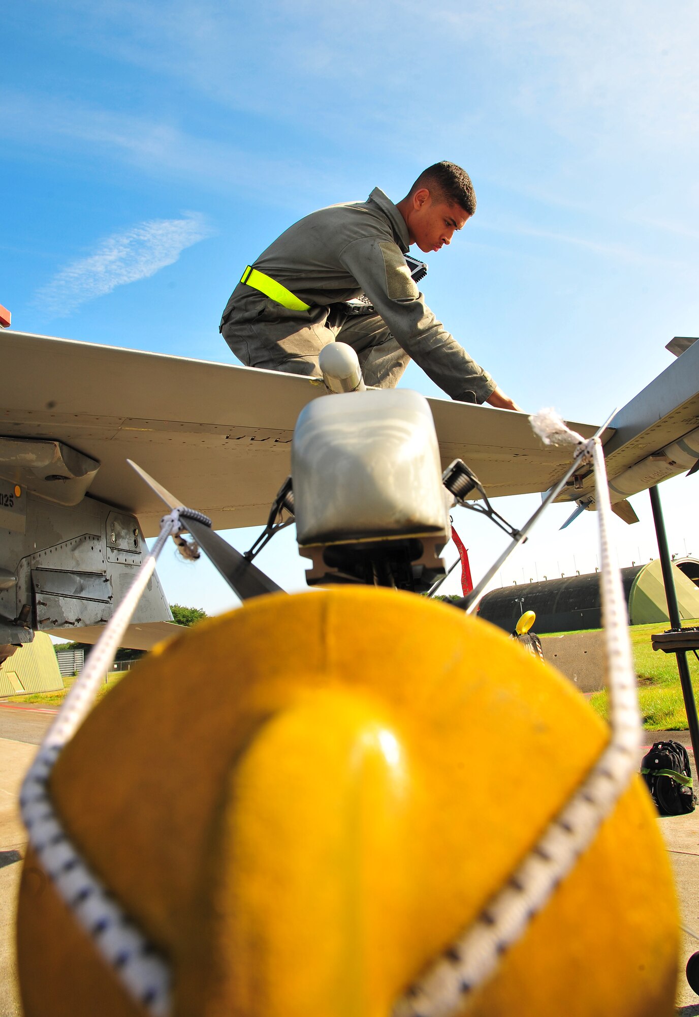 U.S. Air Force Airman 1st Class Kyle Lacy, 14th Aircraft Maintenance Unit crew chief, tightens screws on the wing of an F-16 Fighting Falcon during Exercise Beverly Sunrise 14-08 at Misawa Air Base, Japan, Sept. 14, 2014. This exercise focused on the base’s maintenance and operation group’s ability to generate rapid-response airpower. (U.S. Air Force photo by Senior Airman Jose L. Hernandez-Domitilo/Released)