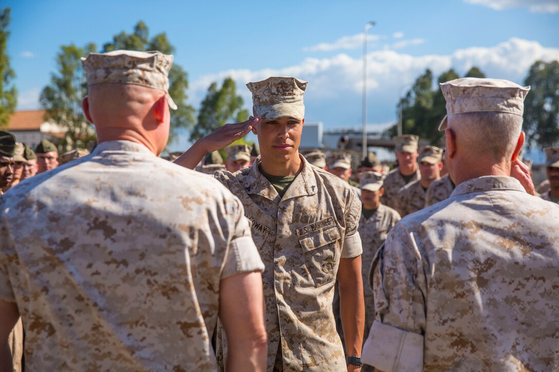 Lance Corporal Antonio C. Galloway (center), an aircraft communications, navigation, electrical and weapon systems technician with Marine Medium Tiltrotor Squadron [VMM 264], is meritoriously promoted to the rank of corporal by General James F. Amos (right), 35th Commandant of the Marine Corps and Sgt. Maj. Micheal P. Barrett (left), Sergeant Major of the Marine Corps, during a visit to Special-Purpose Marine Air-Ground Task Force 14 aboard Naval Air Station Sigonella, Sicily, Sept. 3, 2014. (U.S. Marine Corps photo by Cpl. Shawn Valosin)