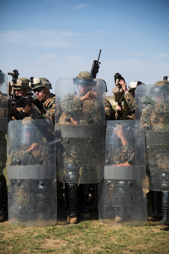 Marines from Golf Co., 2nd Battalion, 2nd Marines make an anti-riot formation on Black Sea Rotational Force 14 Sept. 9 during a non-lethal weapons course on Mihail Kogalniceanu Air Base, Romania. Sustainment in these skills will improve military-to-military engagements with Eastern European partner nations during the current iteration’s rotation. (U.S. Marine Corps photo by Cpl. Alexandria Blanche, 2d MAR DIV, Combat Camera/Released)