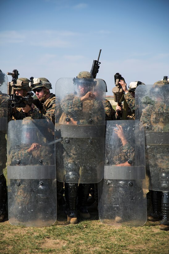 Marines from Golf Co., 2nd Battalion, 2nd Marines make an anti-riot formation on Black Sea Rotational Force 14 Sept. 9 during a non-lethal weapons course on Mihail Kogalniceanu Air Base, Romania. Sustainment in these skills will improve military-to-military engagements with Eastern European partner nations during the current iteration’s rotation. (U.S. Marine Corps photo by Cpl. Alexandria Blanche, 2d MAR DIV, Combat Camera/Released)