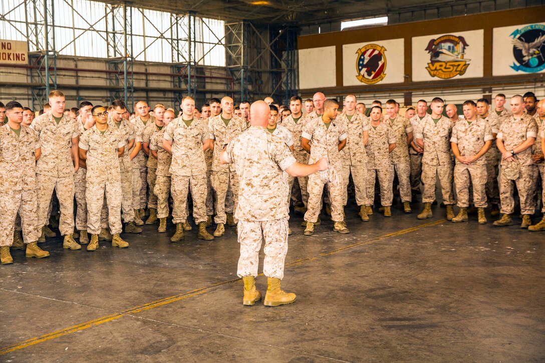 Sgt. Maj. James J. McCook, the sergeant major for U.S. Marine Corps Forces Europe and Africa, speaks with service members from Special-Purpose Marine Air-Ground Task Force Africa 14 aboard Naval Air Station Sigonella, Sept. 13, 2014 During the visit, Maj. Gen. William D. Beydler, the commanding general of II Marine Expeditionary Force and U.S. Marine Corps Forces Africa, and McCook thanked the service members for their hard work and dedication to mission accomplishment and stressed the importance of maintaining readiness, reminding them that they could be called to action at a moment’s notice. (U.S. Marine Corps photo by Cpl. Shawn Valosin)