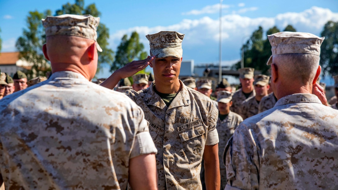 Lance Corporal Antonio C. Galloway (center), an aircraft communications, navigation, electrical and weapon systems technician with Marine Medium Tiltrotor Squadron [VMM 264], is meritoriously promoted to the rank of corporal by General James F. Amos (right), 35th Commandant of the Marine Corps and Sgt. Maj. Micheal P. Barrett (left), Sergeant Major of the Marine Corps, during a visit to Special-Purpose Marine Air-Ground Task Force 14 aboard Naval Air Station Sigonella, Sicily, Sept. 3, 2014. (U.S. Marine Corps photo by Cpl. Shawn Valosin)