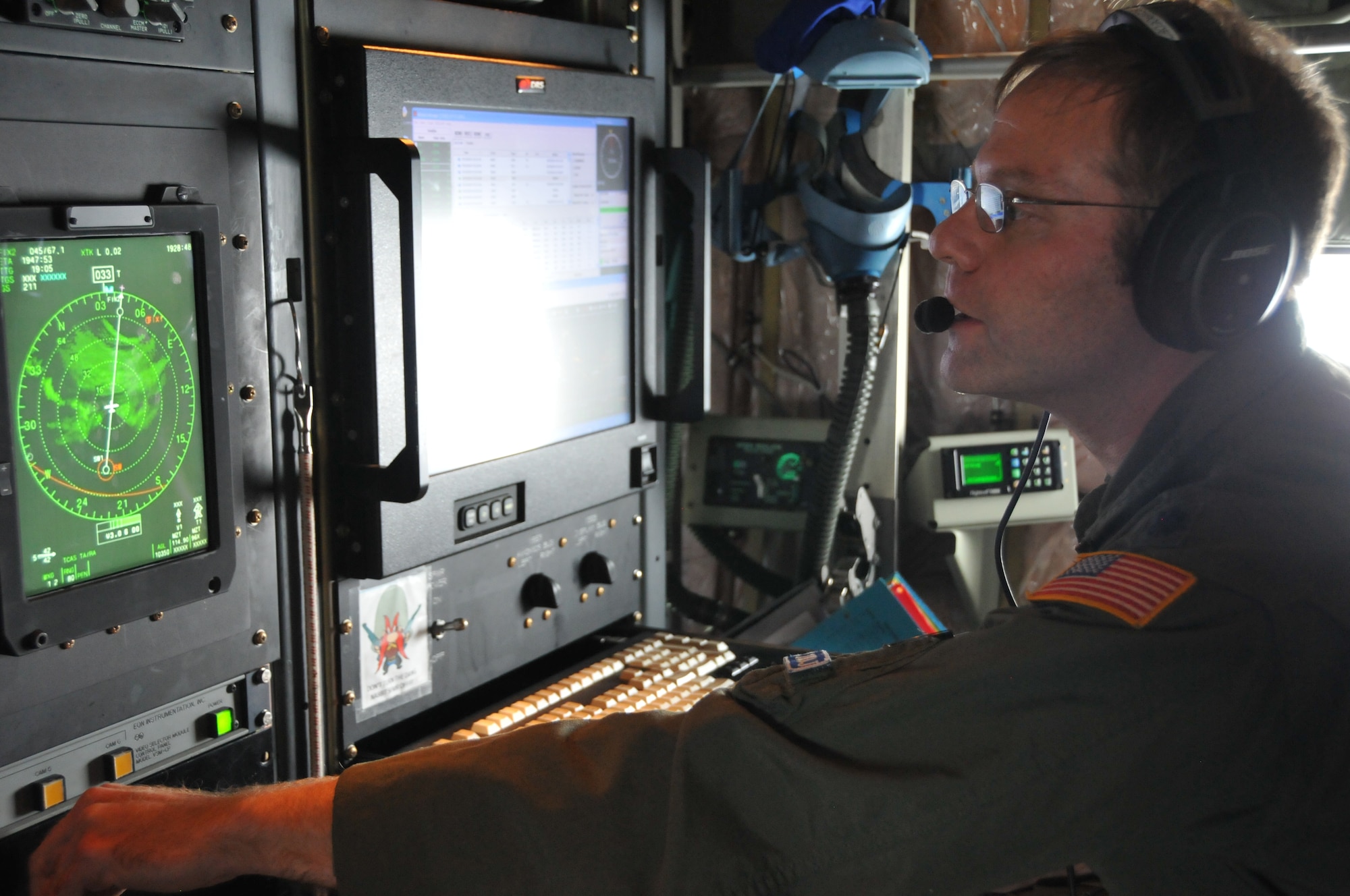 Lt. Col. Brian Schroeder, 53rd Weather Reconnaissance Squadron aerial reconnaissance weather officer, collects data on Hurricane Odile Sept. 14, 2014. The Hurricane Hunters collect weather data for the U.S. National Hurricane Center in Miami, which assists them with their forecasts. (U.S. Air Force photo/Senior Airman Nick Monteleone) 