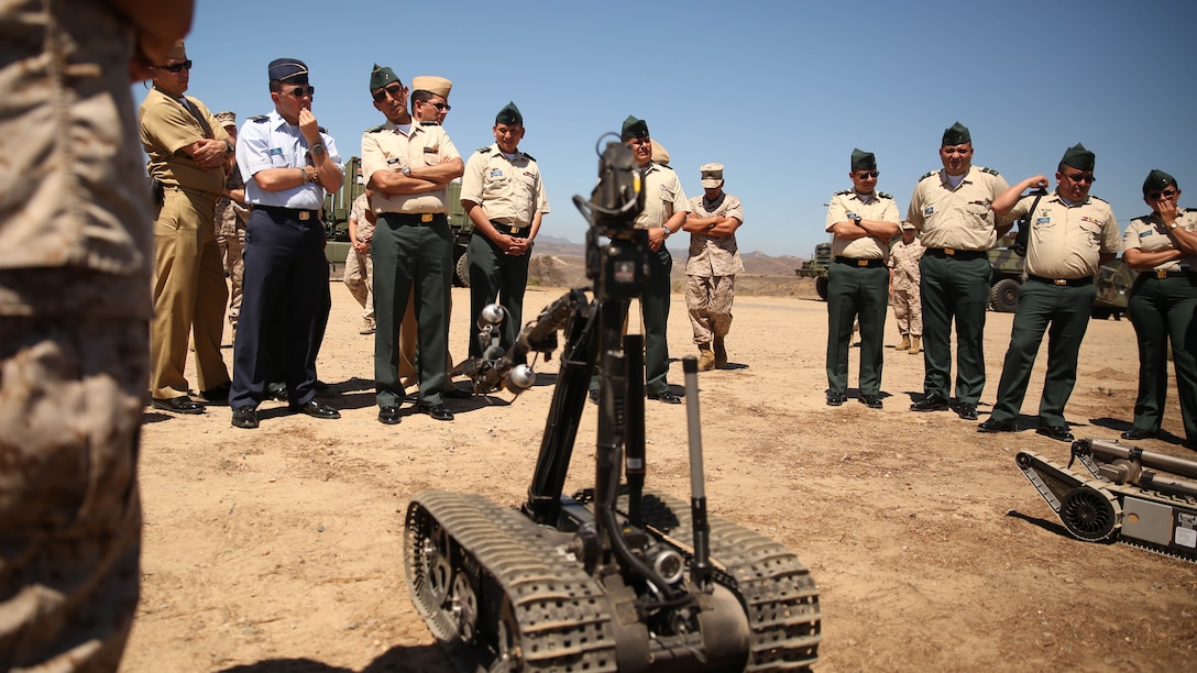 Brigadier Gen. Leonardo Pinto Morales, commander of the 7th Division of the Colombian Army, observes a demonstration and static display of an explosive ordnance disposal robot as part of the Colombian Observance Exchange Program Sept. 2, 2014, aboard Camp Pendleton, Calif. More than thirty officers of the Colombian School of Advanced Warfighting visited 1st MLG to allow members of both the U.S. Marine Corps and Colombian Armed Forces to build an understanding of services, share best practices and strengthen camaraderie and interoperability. 