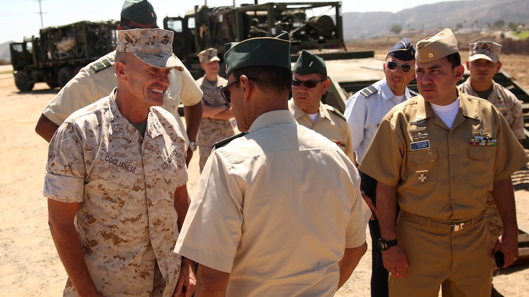 Major Gen. Vincent A. Coglianese, 1st Marine Logistics Group Commanding General, speaks with Brig. Gen. Leonardo Pinto Morales, commander of the 7th Division of the Colombian Army, during the Colombian Observance Exchange Program Sept. 2, 2014, aboard Camp Pendleton, Calif. More than thirty officers of the Colombian School of Advanced Warfighting visited 1st MLG to allow members of both the U.S. Marine Corps and Colombian Armed Forces to build an understanding of services, share best practices and strengthen camaraderie and interoperability. 