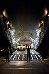 Air Force Tech. Sgt. Cecil Dickerson, a loadmaster from the Alaska Air National Guard's 249th Airlift Squadron, directs an Army Humvee onto a Mississippi Air National Guard C-17 aircraft at the Kentucky Air National Guard Base in Louisville, Ky., on Jan. 27, 2010. The Humvee, along with 90 tons of other equipment and about 40 soldiers from the 3rd Sustainment Command (Expeditionary), are deploying to Port-au-Prince, Haiti, for earthquake relief efforts as part of Operation Unified Response. The Fort Knox, Ky.-based unit is expected to stay in Haiti for up to six months.