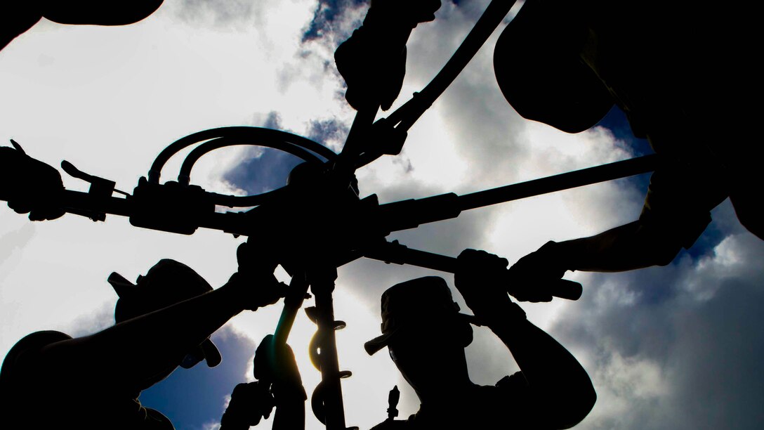 Marine Wing Support Squadrons 171 and 172, both currently assigned to Marine Aircraft Group 12, 1st Marine Aircraft Wing, III Marine Expeditionary Force, drill a hole into the ground as part of the M31 Marine Corps expeditionary arresting gear system in preparation for Valiant Shield 2014. Arresting gear is used to stop aircraft quickly in case they land on a short runway or experience an emergency. Valiant Shield is a a U.S. only exercise integrating U.S. Navy, Air Force, Army and Marine Corps assets, offering real-world joint operational experience to develop capabilities that provide a full range of options to defend U.S. interests and those of its allies and partners. 