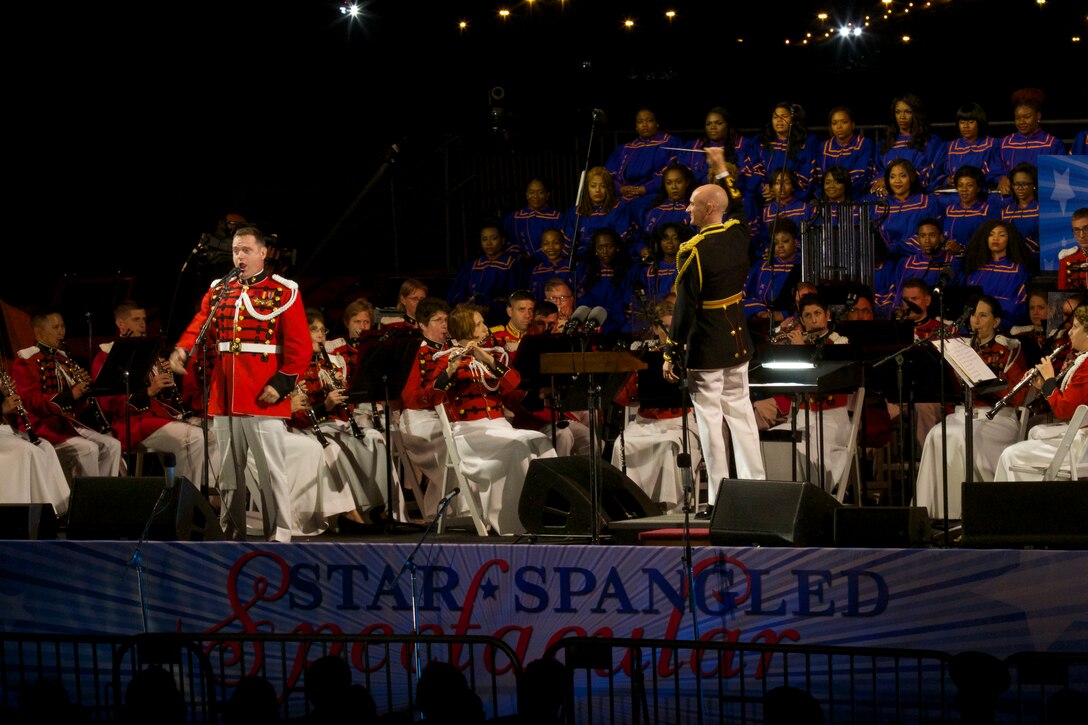 On Sept. 13, 2014, “The President’s Own” performed a concert at Fort McHenry in Baltimore for a celebration commemorating the 200th anniversary of our National Anthem. The Star-Spangled Spectacular program included remarks by Vice President Joe Biden, the Morgan State University Choir, and a performance of the anthem by the Marine Band and Jordin Sparks. Pictured, Marine Band baritone vocalist Master Sgt. Kevin Bennear. (U.S. Marine Corps photo by Gunnery Sgt. Amanda Simmons/released)
