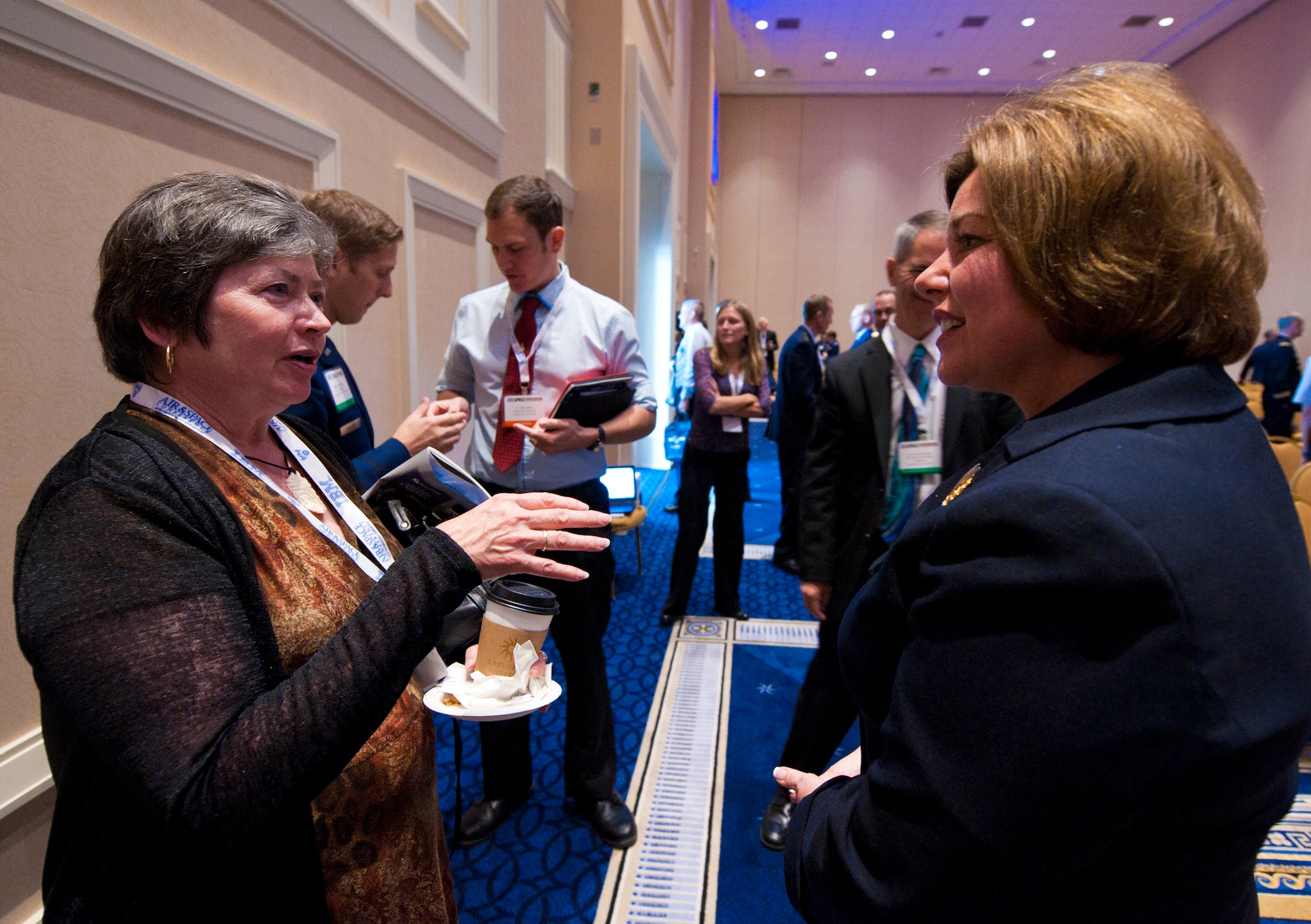Ms. Heidi H. Grant speaks with an attendee after a question and answer session on Air Force global security partnerships at the Air Force Association Air & Space Symposium, Sept. 15, 2014, in Washington D.C. Grant is a member of the Senior Executive Service and is the deputy under secretary of the Air Force for international affairs, Washington D.C.  (U.S. Air Force photo/Staff Sgt. Anthony Nelson Jr)