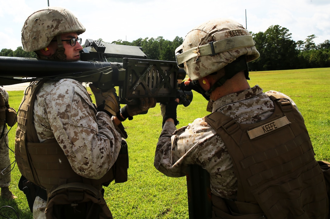 Cpl. Joseph D. Keefe, left, preps the PL-87 Stinger missile system for Sgt. Ryan C. Johnson during a simulated missile shoot as part of 2nd Low Altitude Air Defense Battalion’s section leader course and team leader course at Marine Corps Air Station Cherry Point, N.C., Sept. 11, 2014. Keefe and Johnson are both gunners with 2nd LAAD attending section leader course; firing the Stringer missile was their final exercise. Keefe is a native of Boston and Johnson is a native of Long Island, N.Y.