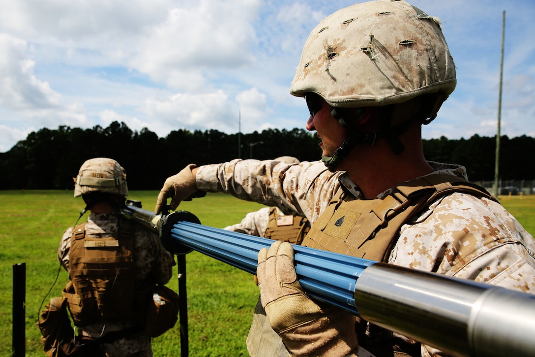 Sgt. Ben W. Cole loads a round into a PL-87 Stinger missile during a simulated missile shoot as part of 2nd Low Altitude Air Defense Battalion’s section leader course and team leader course at Marine Corps Air Station Cherry Point, N.C., Sept. 11, 2014. Cole is a course instructor with 2nd LAAD and is a native of Linden, Mich.