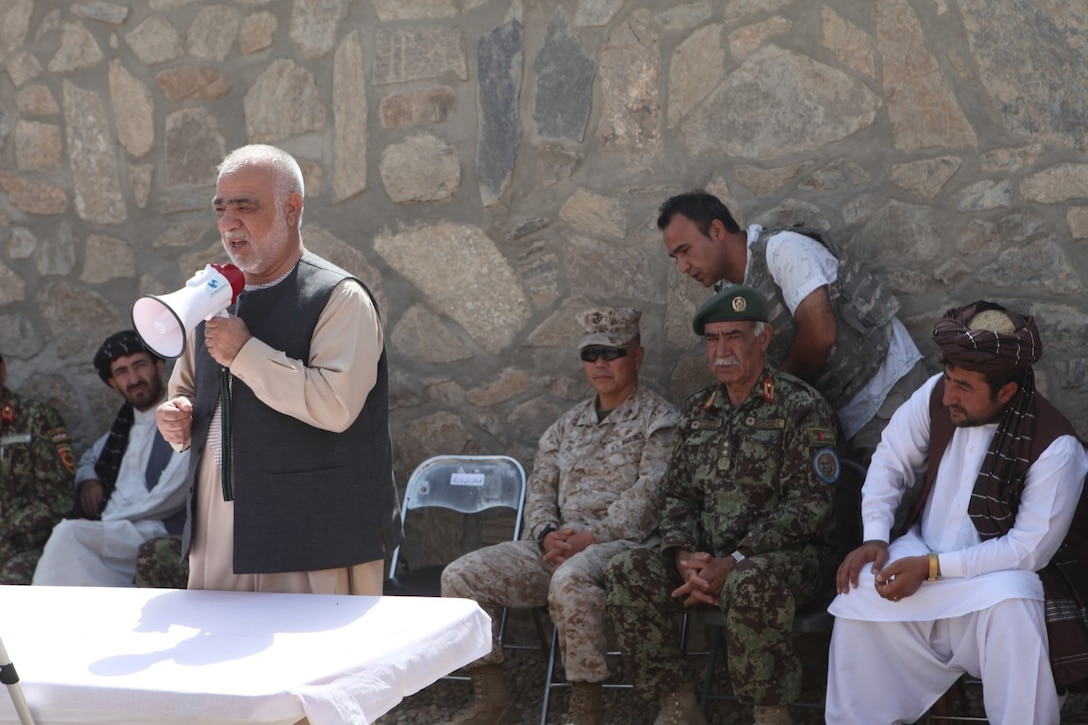 Mr. Naeem Baloch, governor of Helmand province, addresses Afghan National Army soldiers during a ribbon-cutting ceremony aboard New Camp Garm Ser, Helmand province, Afghanistan, Sep. 1, 2014. New Camp Garm Ser was officially opened for the ANA as a southern post to sustain their forces in the operating area without having to come back to their central location on Camp Shorabak on a regular basis. (U.S. Marine Corps photo by Cpl. Cody Haas)
