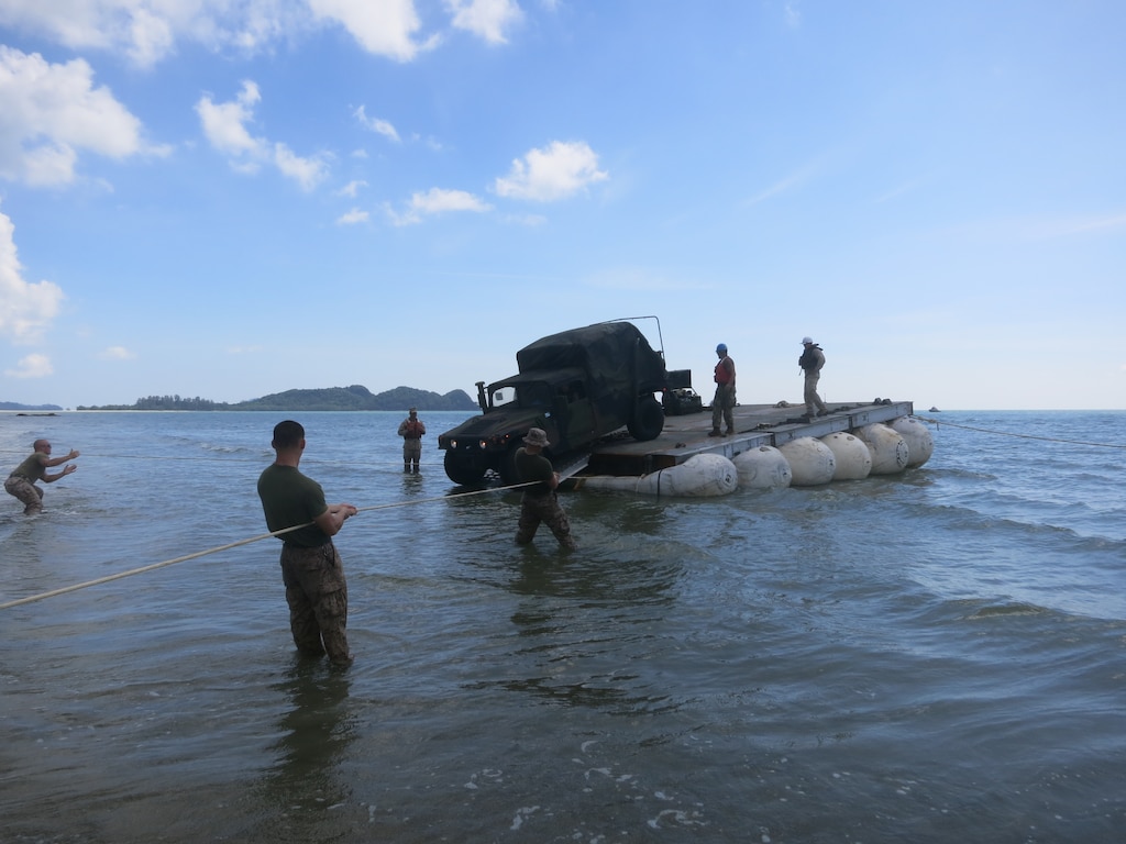 Marines drive a Humvee off the LMCS onto the beach near Mersing, Malaysia.