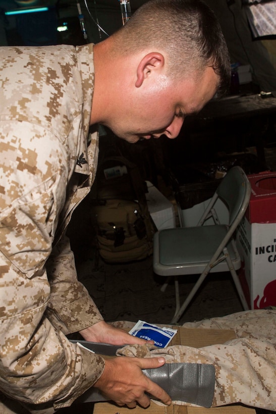 Petty Officer 3rd Class Michael Wheeler places an ankle brace on a patient during a mass casualty drill Sept. 10 on Tinian. The purpose behind the drill is to test the capabilities of the field’s medical staff by challenging them with varying scenarios to test their knowledge and abilities. The corpsmen are on the island as part of Exercise Valiant Shield 2014, a biennial exercise which focuses on training that enables real-world proficiency in sustaining joint forces. Wheeler is a hospital corpsman with Marine Wing Support Squadron 171, Marine Aircraft Group 12, 1st Marine Aircraft Wing, III Marine Expeditionary Force. (U.S. Marine Corps photo by Lance Cpl. Luis Ramirez/Released)