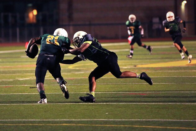 The Headquarters and Support Battalion Spartans beat the School of Infantry Outlaws, 13-7 in a hard fought, low-scoring, back-and-forth game. That brought the Spartans to a 2-1 record for the season at the Paige Fieldhouse football field, Sept. 15.