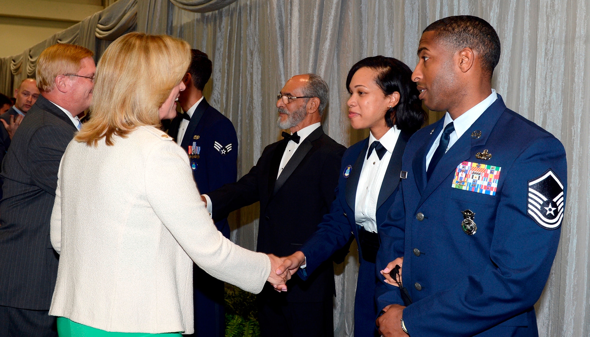 Secretary of the Air Force Deborah Lee James greets Tech. Sgt. Latoria R. Ellis, from the 502nd Contracting Squadron, 502nd Air Base Wing, Joint Base San Antonio-Lackland, Texas. Ellis is one of the 12 Outstanding Airmen of the Year for 2014 who attended a reception and awards dinner during the 2014 Air Force Association's Air & Space Conference and Technology Exposition on Sept. 15, 2014 in Washington, D.C. Other senior leaders in attendance included Chief of Staff of the Air Force General Mark A. Welsh III and his wife, Betty, and Chief Master Sgt. of the Air Force James Cody and his wife, retired Chief Master Sgt. Athena Cody. (U.S. Air Force photo/Andy Morataya)