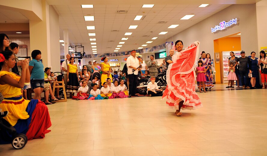 Carla Lauber, a dancer from Ritmo, Color y Sabor, performs the "Marinera Nortena del Peru" during Hispanic Heritage Month at the base exchange on Kadena Air Base, Japan, Sept. 15, 2014. Hispanic Heritage Month, held Sept. 15 through Oct. 15, recognizes the contributions of Hispanic and Latino Americans to the United States and celebrate the group's heritage and culture. (U.S. Air Force photo by Naoto Anazawa/Released)