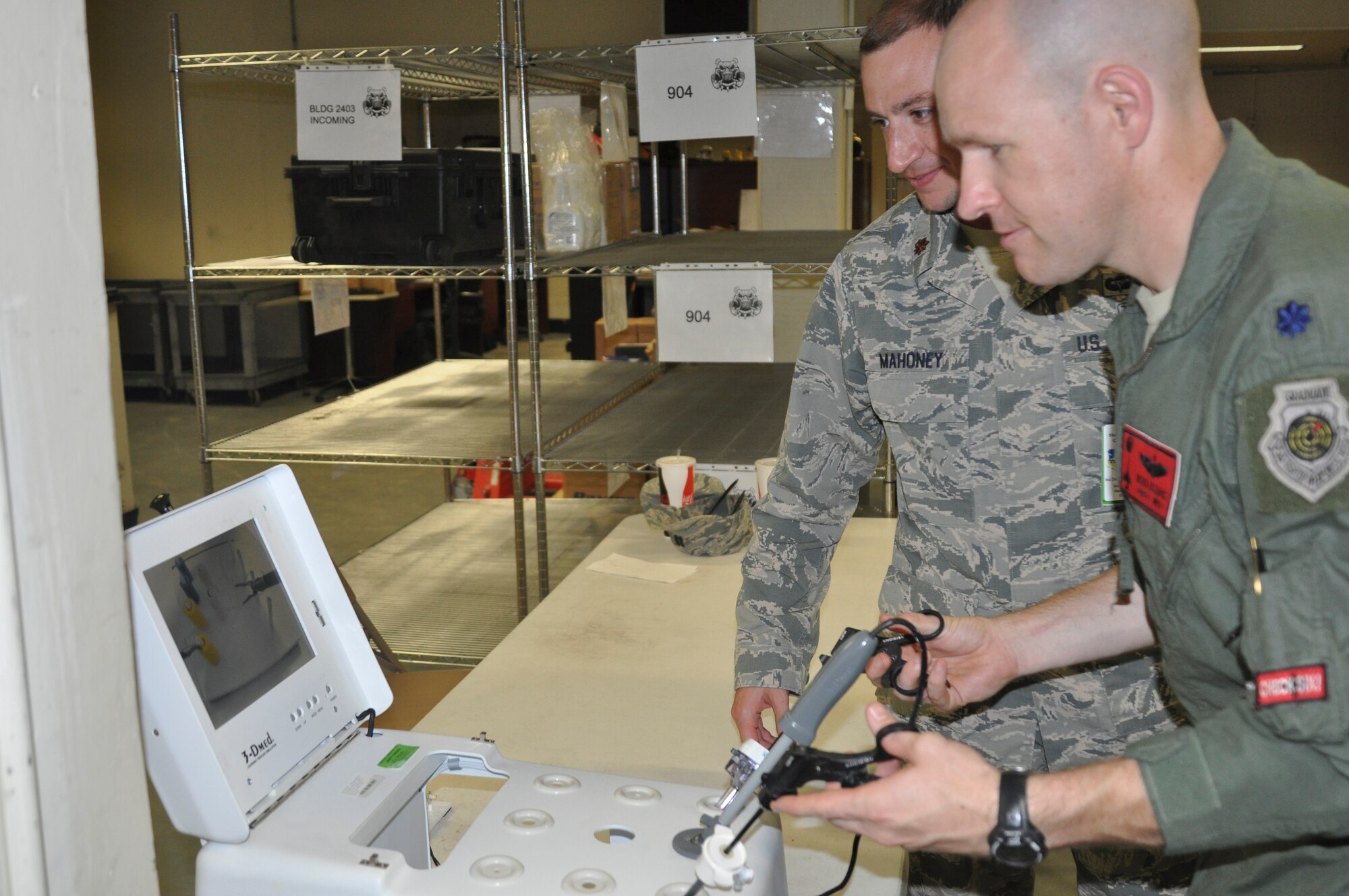 Maj. Christopher Mahoney, 51st Medical Group general surgeon, instructs Lt. Col. Nicholas Evans, 36th Fighter Squadron commander, on how to use labroscopic medical equipment at Osan Air Base, Republic of Korea, Sept. 8, 2014.  Leadership from across Team Osan participated in the annual Mustang Immersion to develop a better understanding of what Osan Airmen are able to bring to the fight.  (U.S. Air Force photo/Capt. Robert Howard)