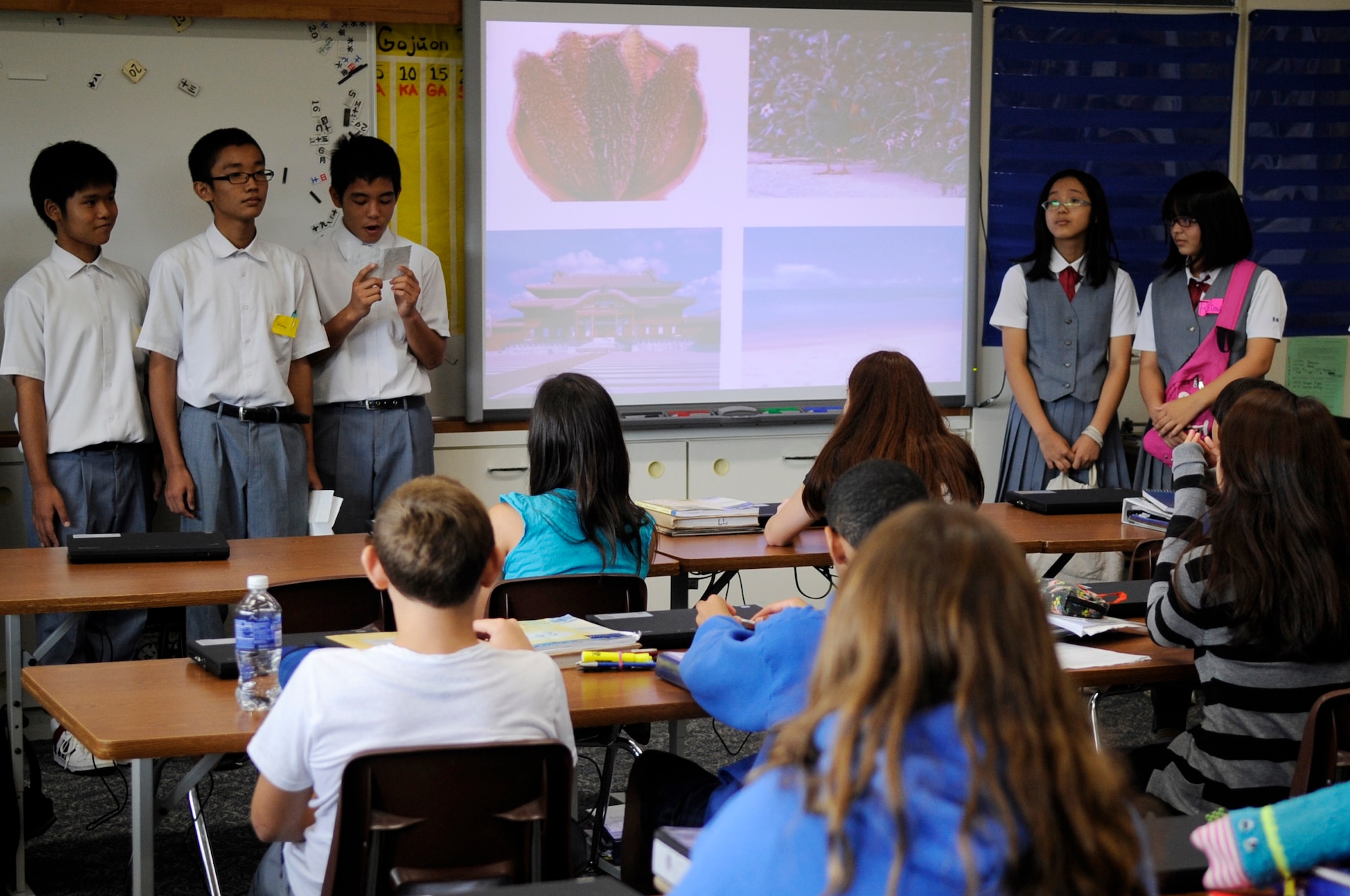 Students from Konan Middle School’s English class show students from Ryukyu Middle School the different types of artwork done in Okinawa, such as glass blowing and bingata, on Kadena Air Base, Japan, Sept. 16, 2014. Teachers from Ryukyu Middle School and Konan Middle School, located in Naha City, created a new exchange program to allow students to share their culture and practice their communication. (U.S. Air Force photo by Senior Airman Marcus Morris/Released)