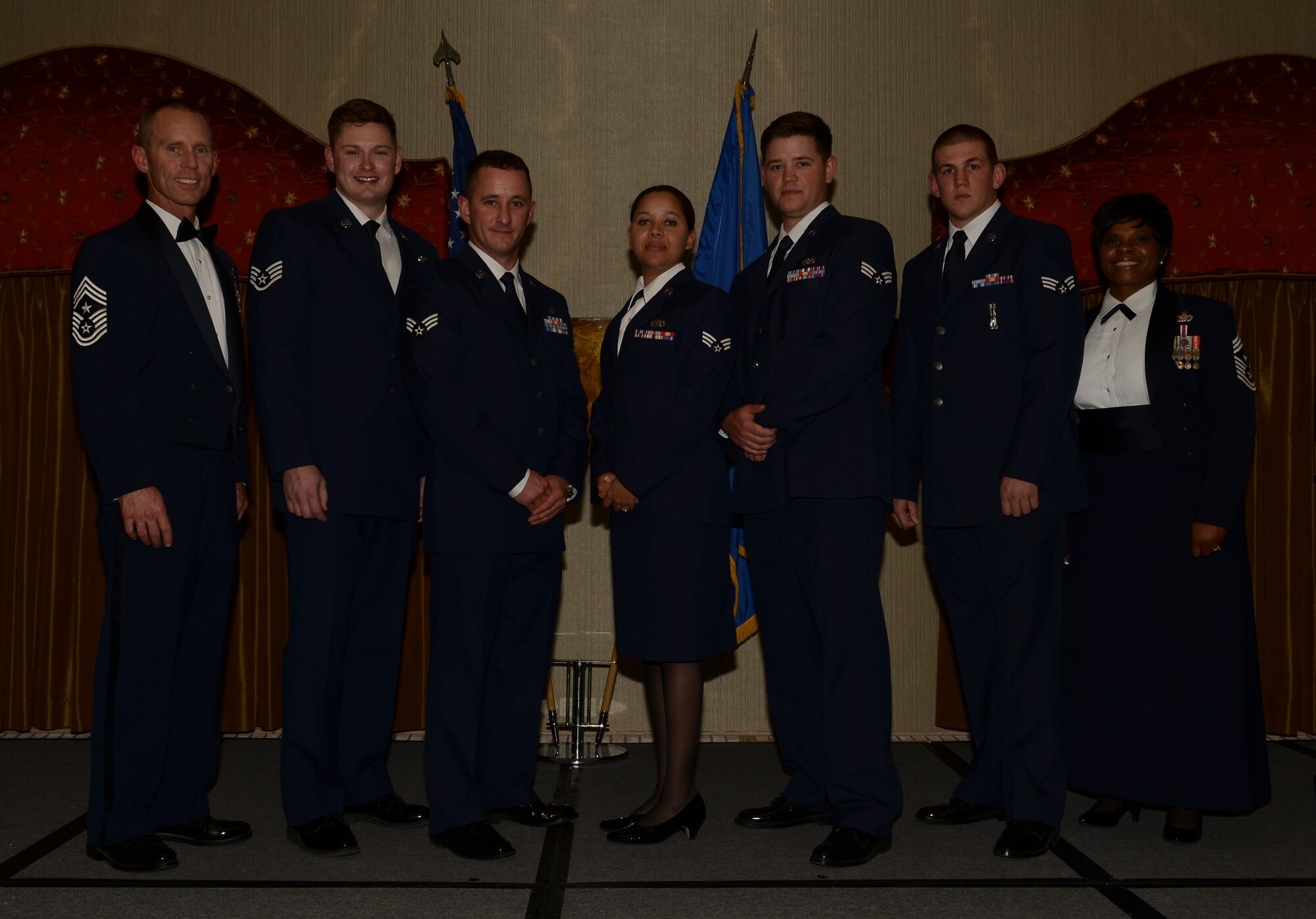 The Airman Leadership School Class 14-G graduated with 48 students during a ceremony held at the Jimmy Doolittle Center here, Sept. 11, 2014. Congratulations to the graduates and special recognition to the following award winners: Commandant's Award: Senior Airman Bryon Black, 5th Munitions Squadron; Academic Achievement Award: Senior Airman Tyler Romack, 91st Maintenance Operation Squadron; Distinguished Graduate Awards: Senior Airman Bryon Black, 5th MUNS, Senior Airman Malia Jenkins, 5th Bomb Wing Public Affairs, Senior Airman Marshal Mcalister, 5th Civil Engineer Squadron, Senior Airman Tyler Romack, 91st MOS; John L. Levitow Award: Staff Sgt. Nicholas Estrada, 54th Helicopter Squadron. Pictured here from left to right are: Chief Master Sgt. Geoff Weimer, 5th BW command chief, Staff Sgt. Nicholas Estrada, Senior Airmen Bryon Black, Malia Jenkins, Marshal Mcalister, Tyler Romack and Chief Master Sgt. Felica Noil, 91st Missile Wing command chief. (U.S. Air Force photo/Master Sgt. Charlene Spade)
