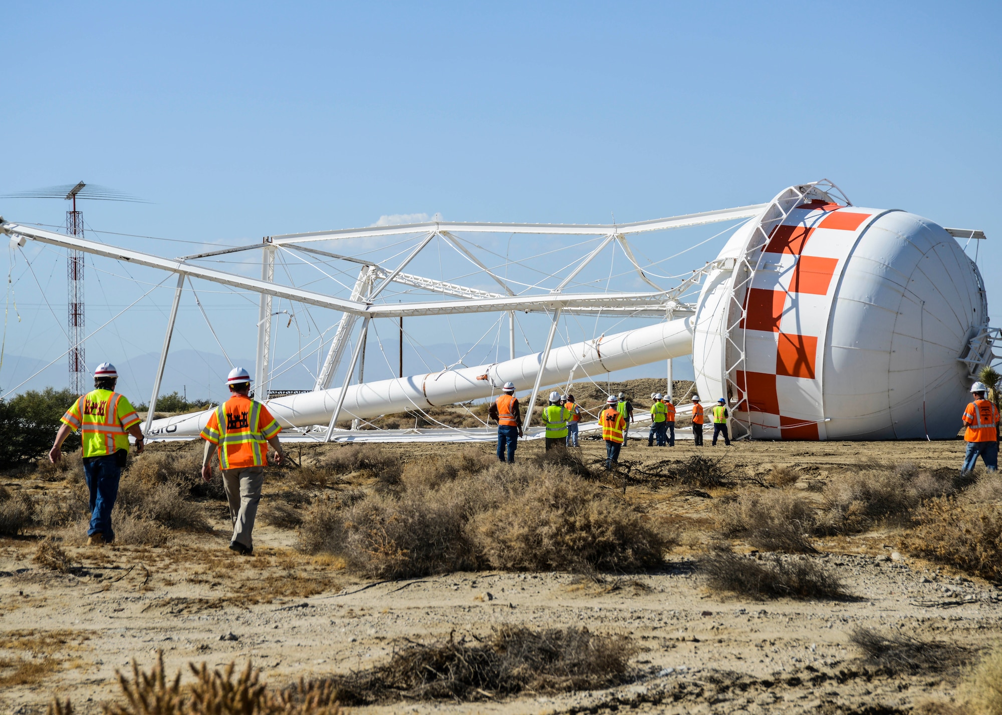 The 160-foot South Base water tower Bldg. 516, was torn down Sept. 16. The 200,000 gallon non-potable water source will be replaced by a 5,000 gallon tank at Branch Pond to supply water to the South Gate entry control building. (U.S. Air Force photo by Rebecca Amber)