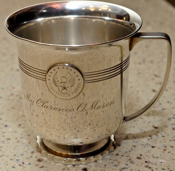 The Maj. Clarence Mason cup is the sixth cup from the Castle Coombe mess toast in 1943. World War II Gen. Ira Eaker raised a toast with eight fellow officers in hopes of victory during the war. Eaker donated the bowl, ladle, and cup to Eighth Air Force April 28, 1981. To date, six of the nine cups are now located in the Eighth Air Force headquarters. (U.S. Air Force photo/Senior Airman Kristin High)