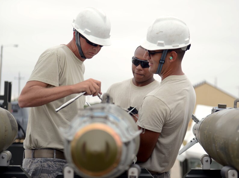 U.S. Air Force Airmen from the 7th Munitions Squadron, assemble components on a global positioning system-guided inert bomb unit during the Global Strike Challenge Sept. 11, 2014, at Dyess Air Force Base, Texas. Global Strike Challenge competitors are selected based upon available wing assets and as determined by the unit’s internal competitive team selection process. (U.S. Air Force photo by Airman 1st Class Kedesha Pennant/Released)
